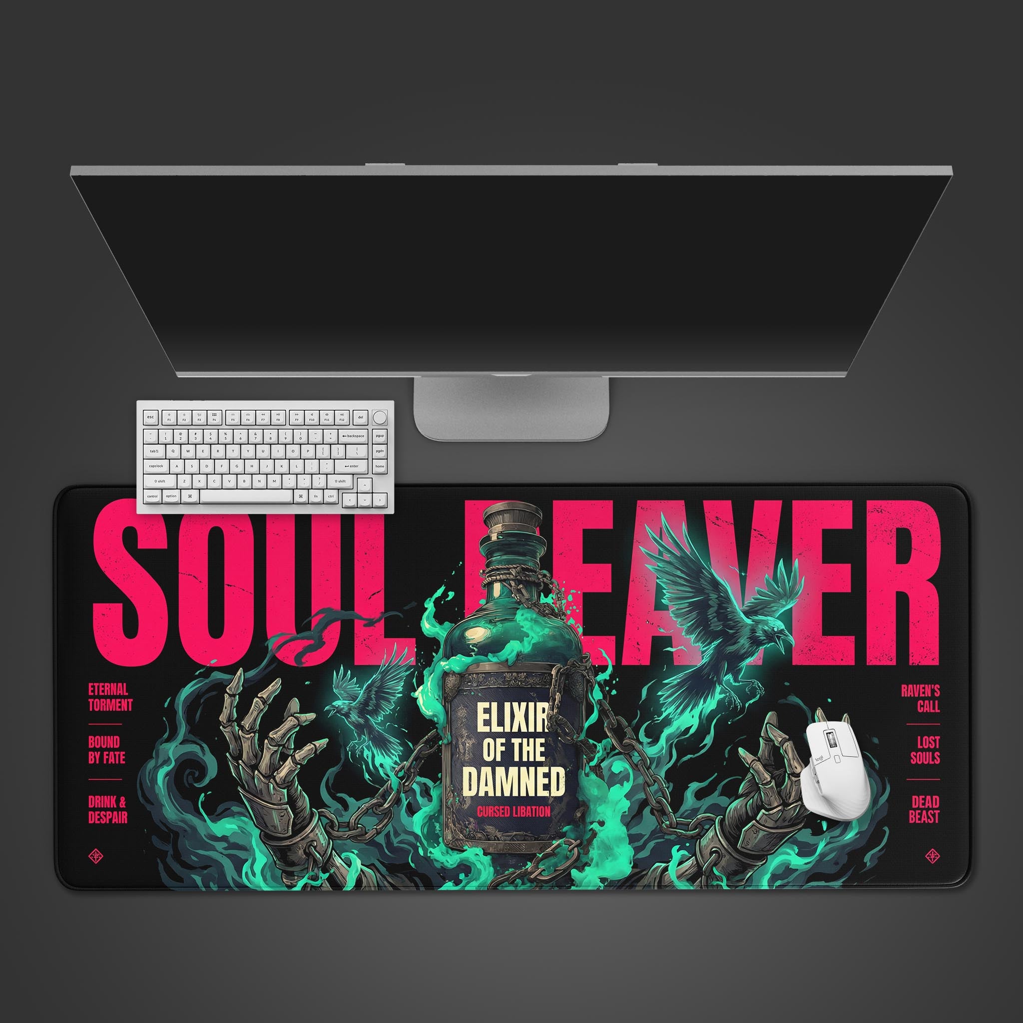 Top-down view of the Soul Reaver gaming desk mat featuring an "Elixir of the Damned" design, shown with a white keyboard, mouse, and a large monitor on a desk. - Epic Design Pads & Mousepads