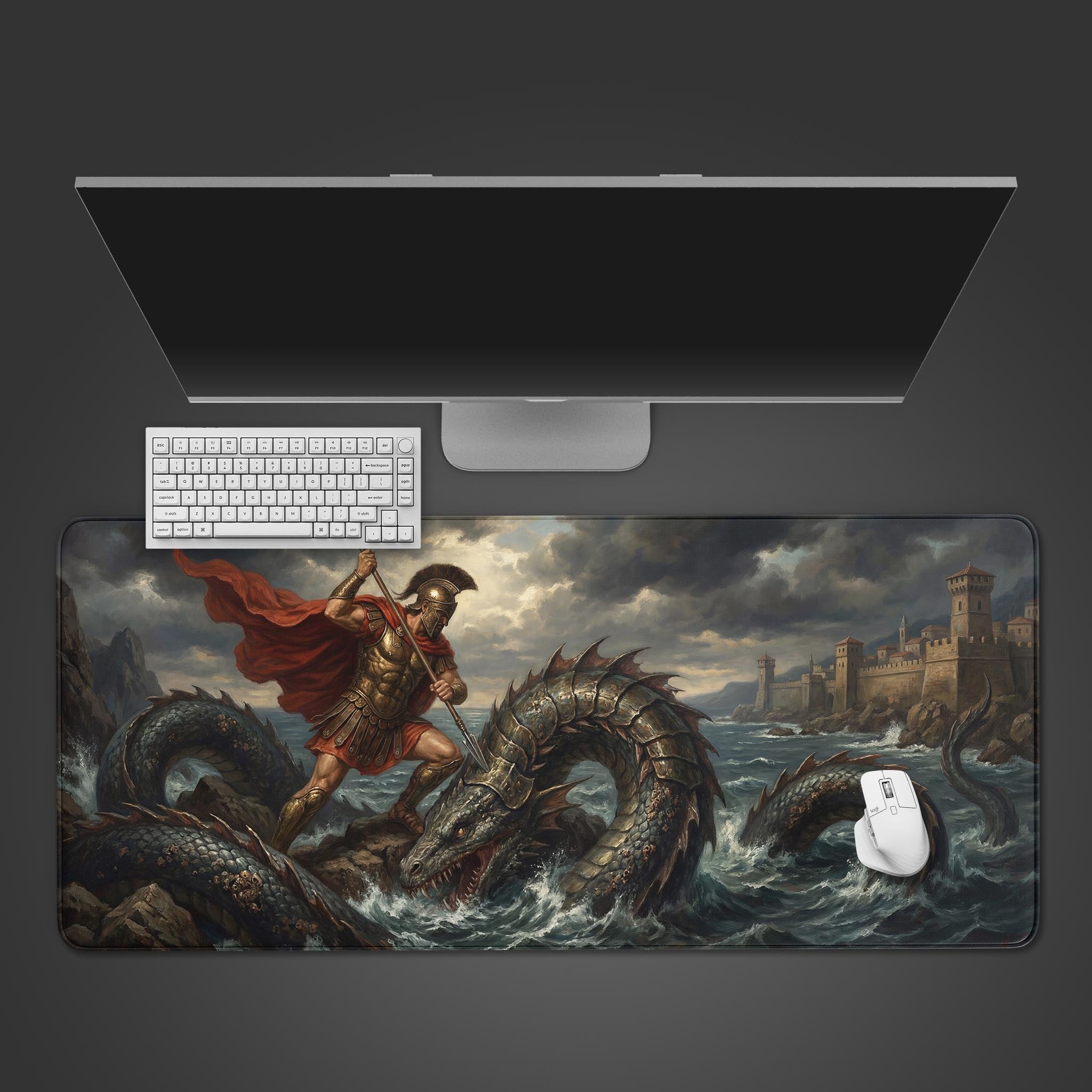 The Spartan's Fury gaming desk mat shown from a top-down view, with a sleek monitor, white keyboard, and white mouse creating a modern setup. - Epic Design Pads & Mousepads