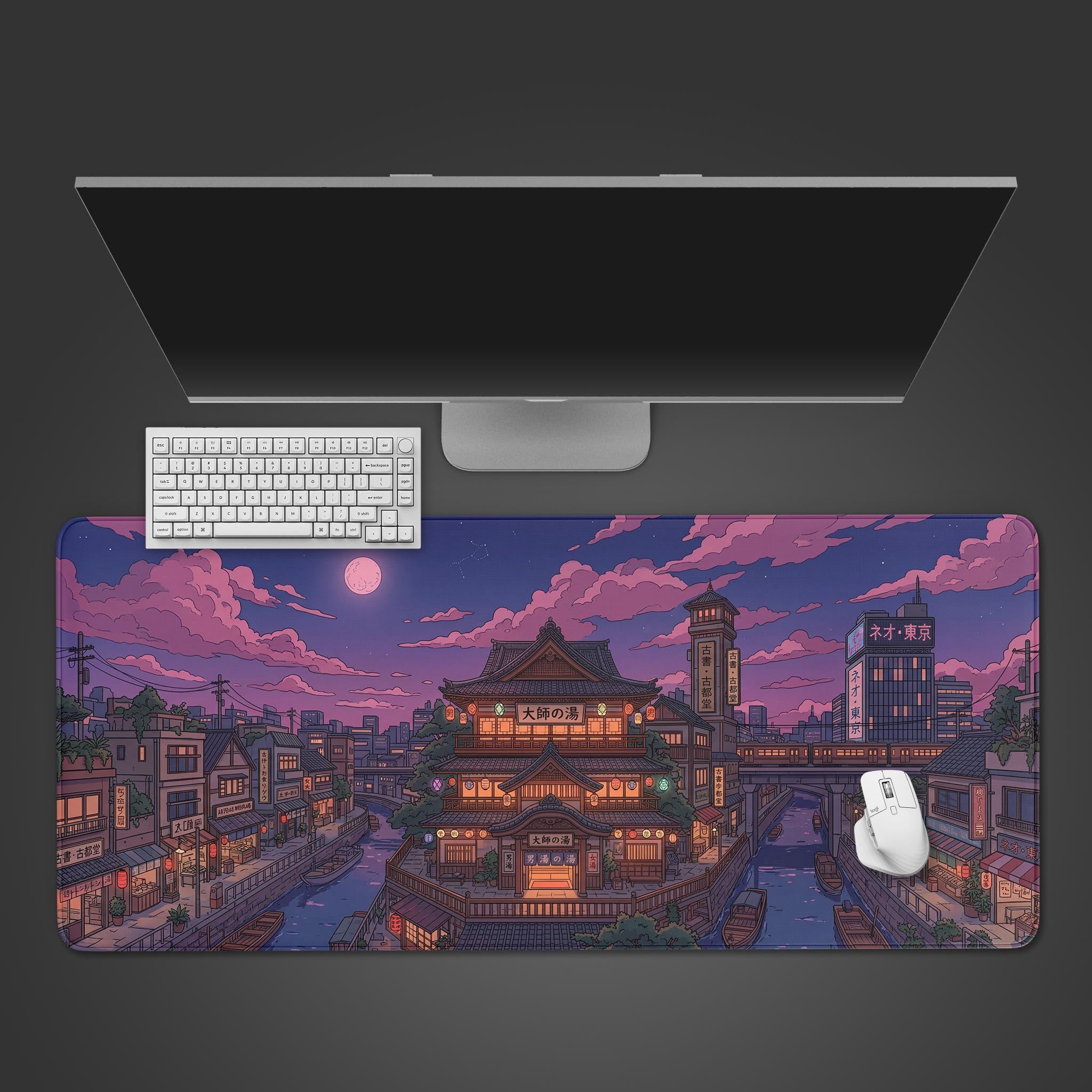 A top-down view of the Spirit River Town gaming desk mat, featuring an anime-style Japanese city at twilight, with a white keyboard and mouse neatly placed on top. - Epic Design Pads & Mousepads