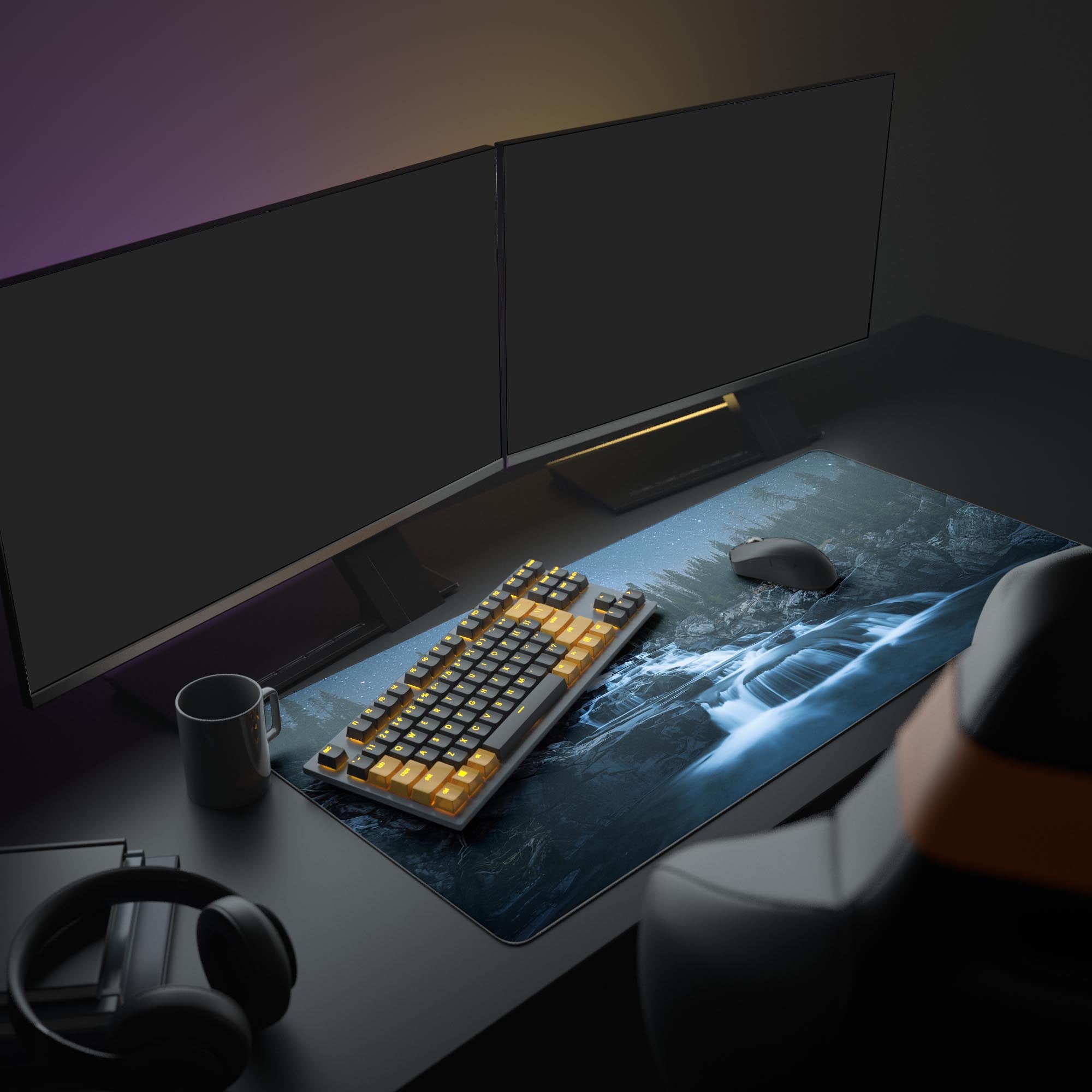 Large Starlight Cascade galaxy desk mat in a full gaming setup with dual monitors, headphones, and a mechanical keyboard. - Epic Design Pads