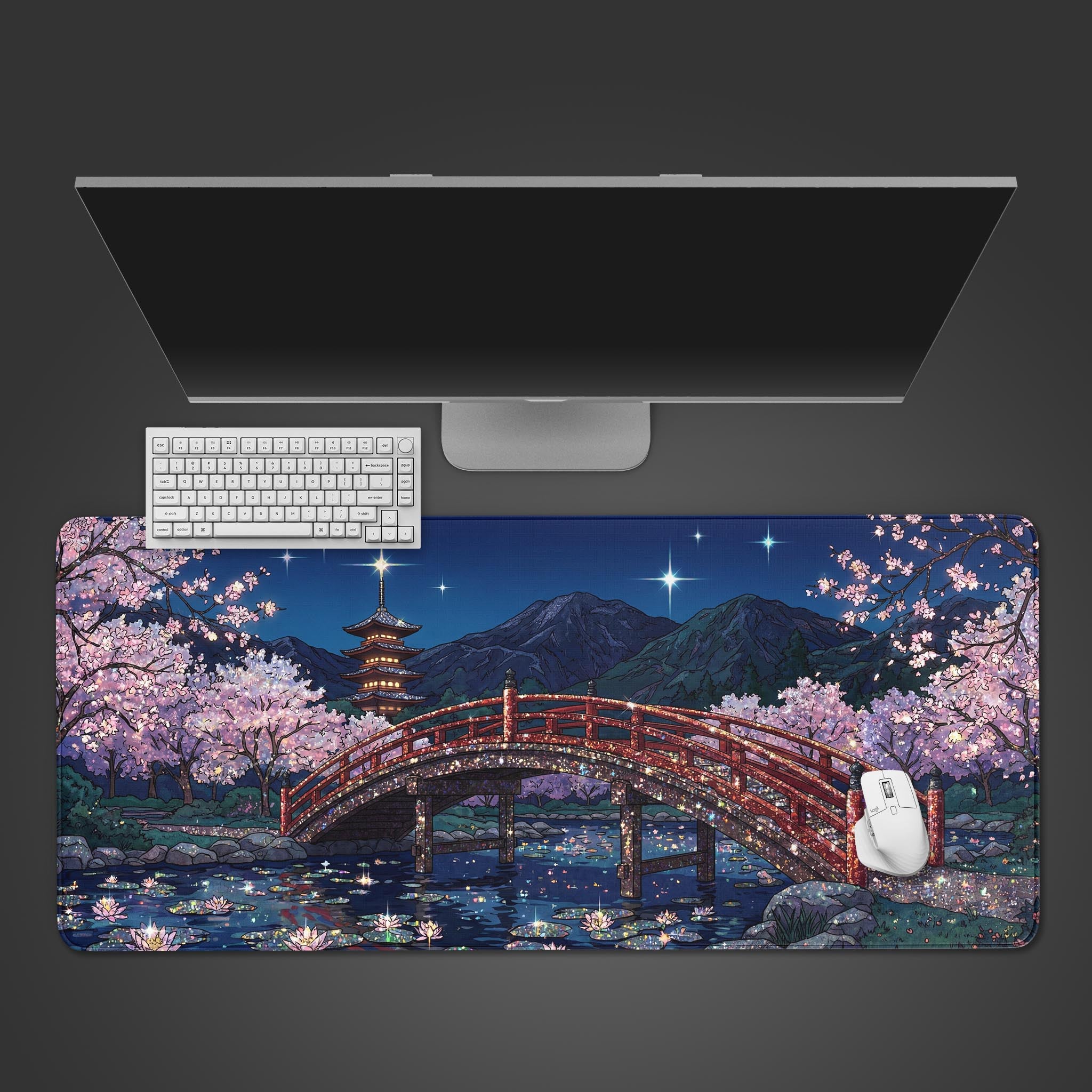 Top-down view of the Starlit Crossing gaming desk mat, showing its Japanese bridge and cherry blossom design beneath a white keyboard and mouse on a dark surface. - Epic Design Pads & Mousepads