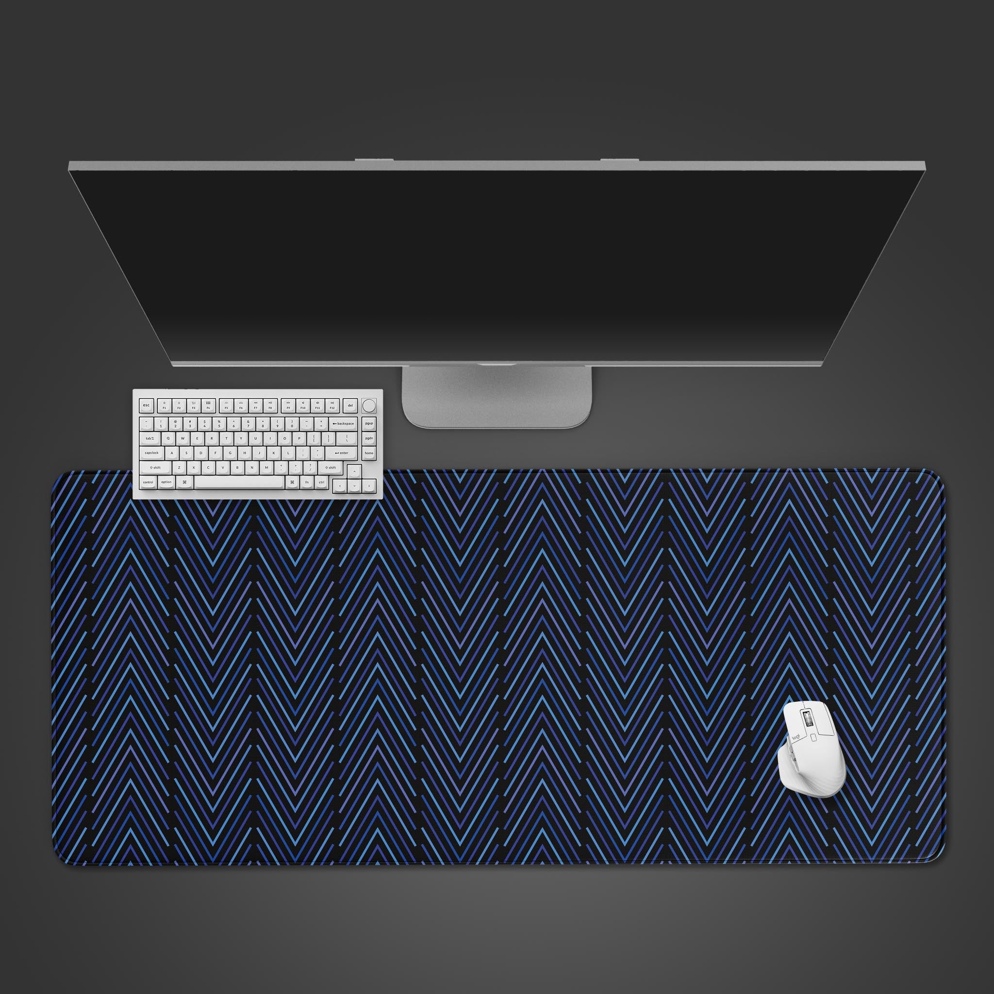 Stripe Pattern geometric desk mat with a blue herringbone design, shown from a top-down view on a desk with a keyboard and mouse. - Epic Design Pads & Mousepads