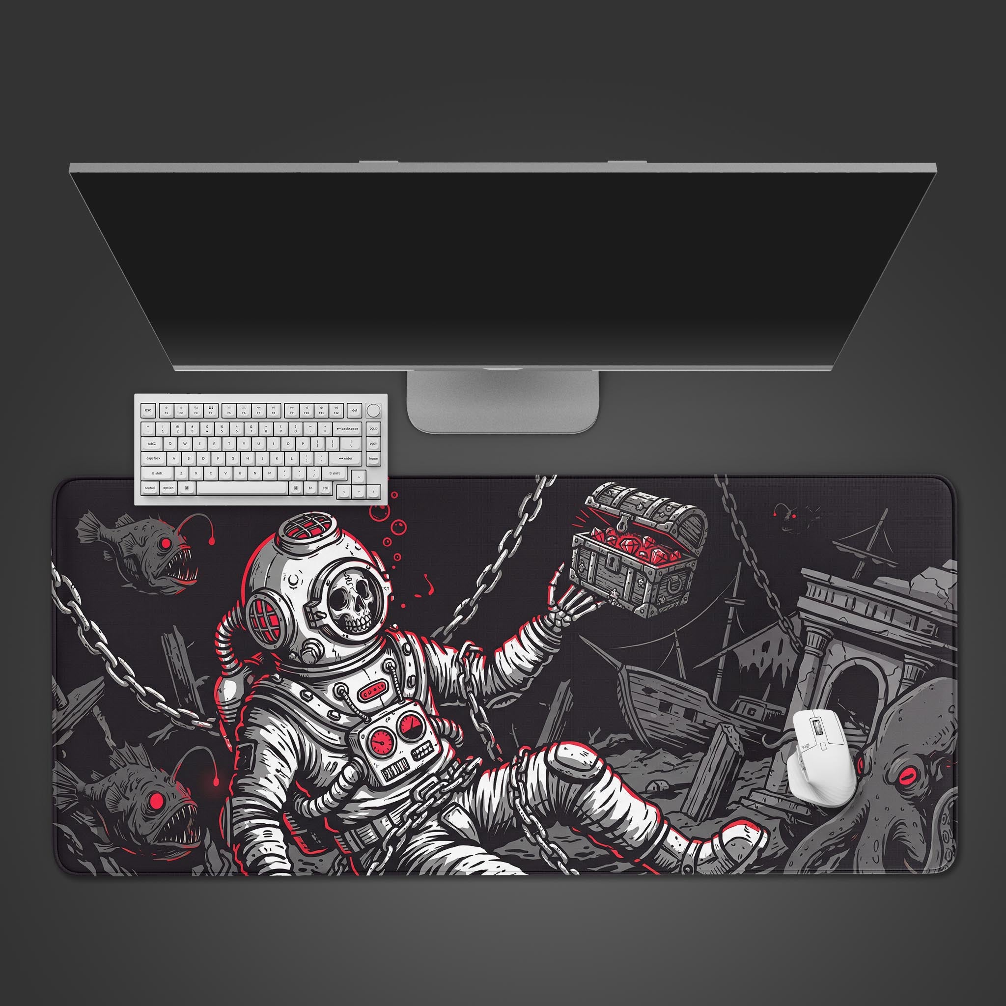 Top-down view of the Sunken Fortune gaming desk mat with its skeletal diver art, positioned with a white keyboard and mouse under a sleek monitor. - Epic Design Pads & Mousepads