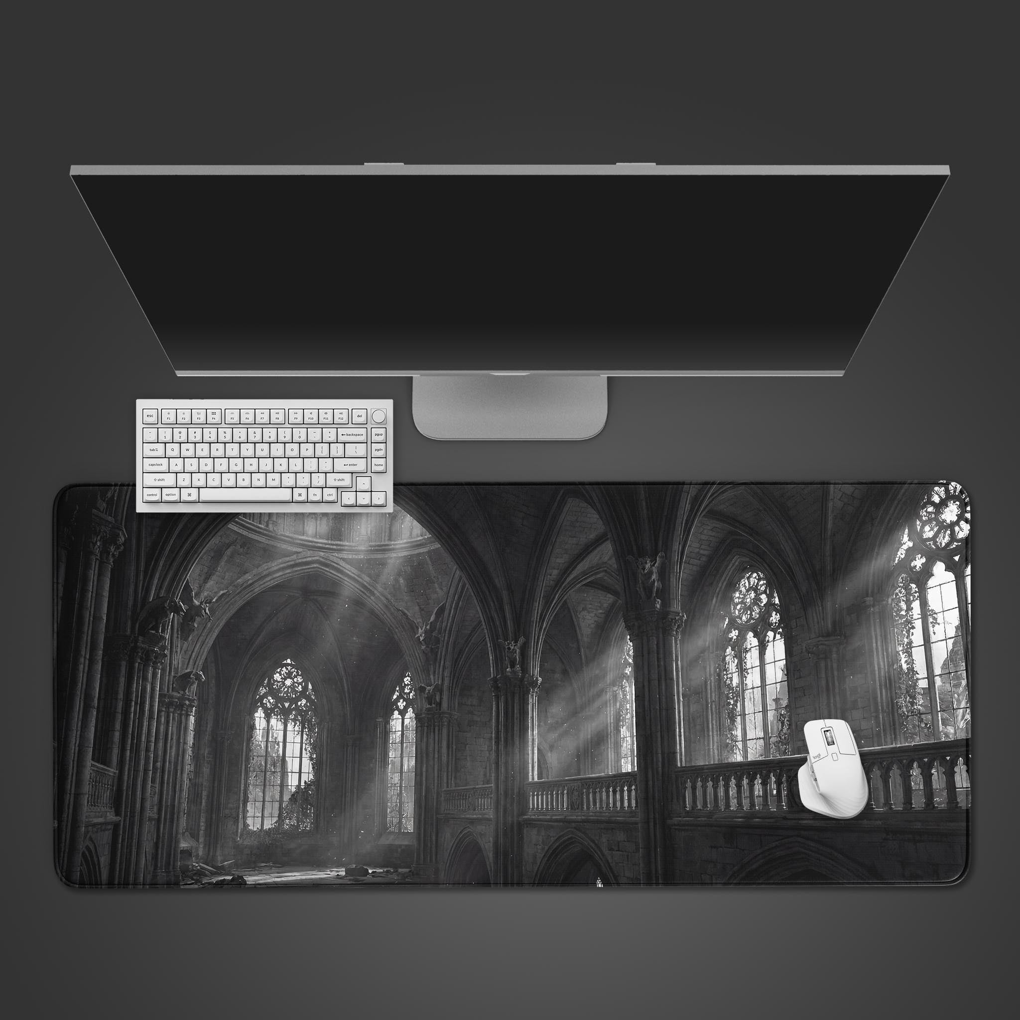 Gothic desk mat with sunlit ruins cathedral design. Top-down view of the monochrome desk pad with a black keyboard and mouse, showing the detailed architecture. - Epic Design Pads & Mousepads
