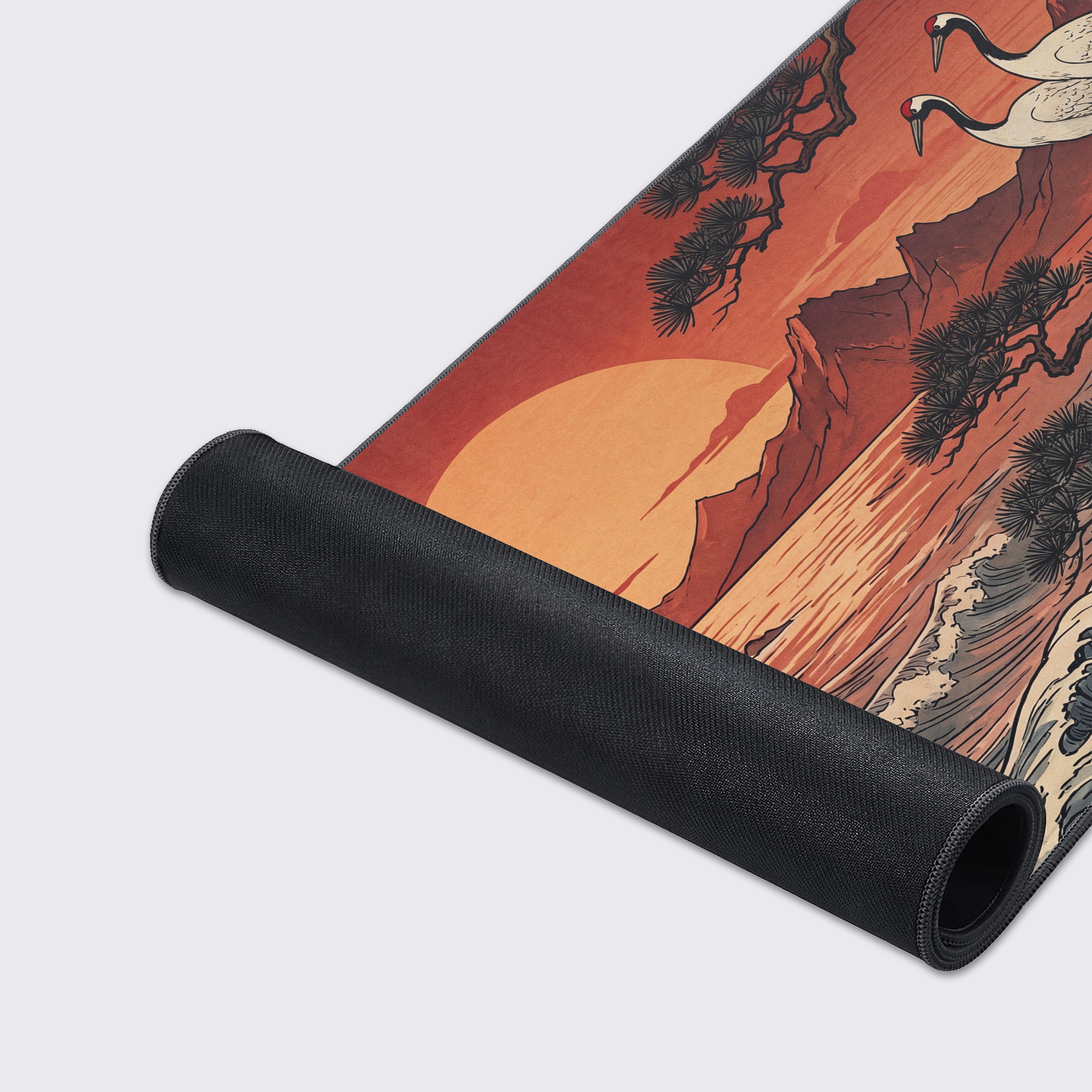 Top-down view of the Sunset Cranes mouse pad highlighting the cranes perched on a detailed pine tree branch