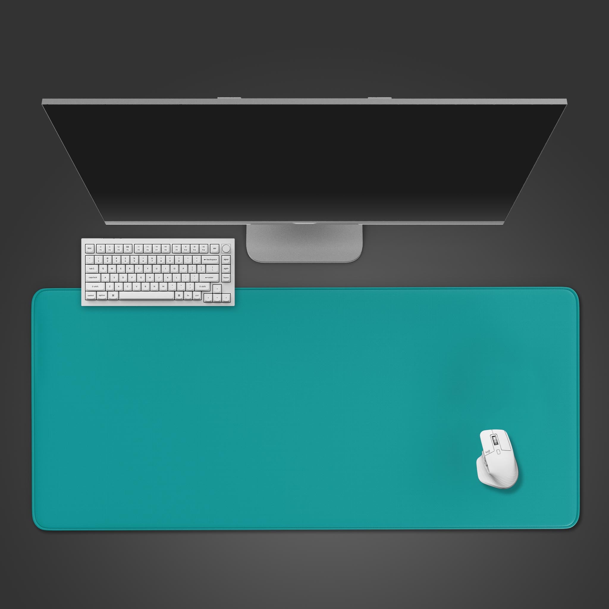 A top-down view of the Teal Focus gaming desk mat, shown with a sleek white keyboard and mouse on a dark, minimalist background. - Epic Design Pads & Mousepads