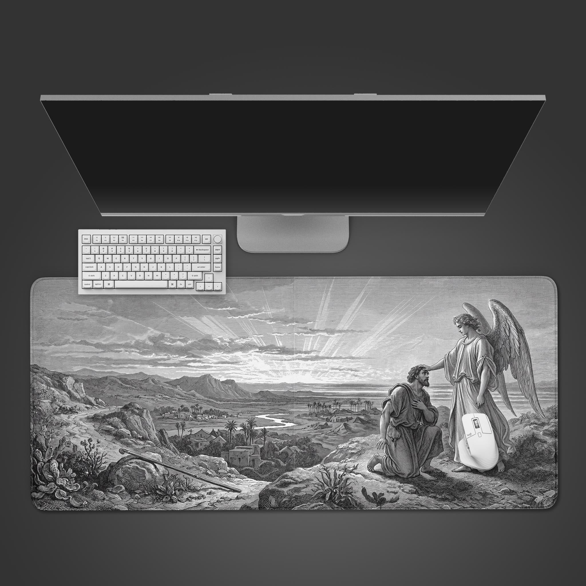 Top-down view of 'The Awakening' gaming desk mat featuring a vintage angel engraving, shown with a white keyboard and mouse on a dark surface. - Epic Design Pads & Mousepads