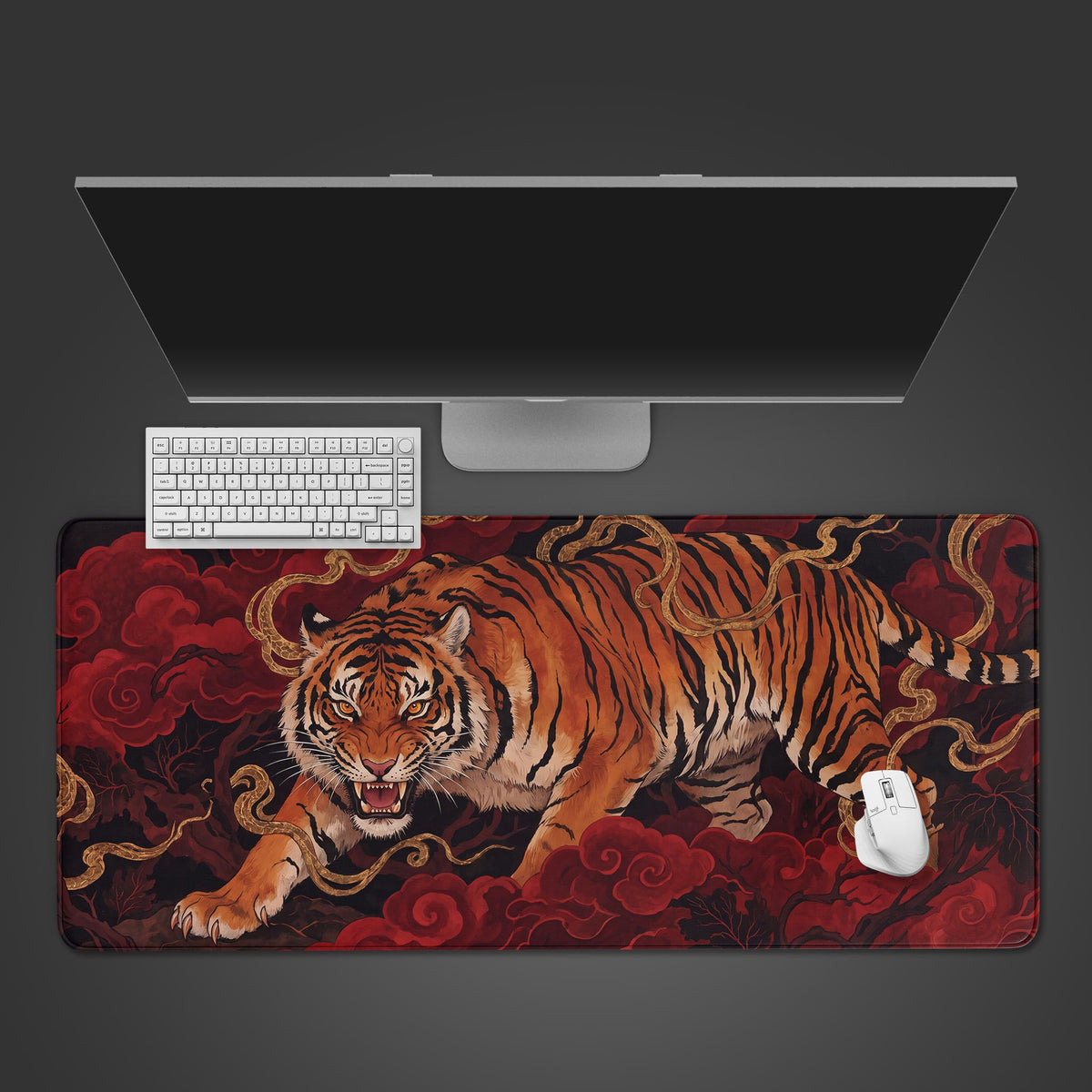 A desk mat featuring a fierce orange tiger walking through deep crimson clouds with golden tendrils.