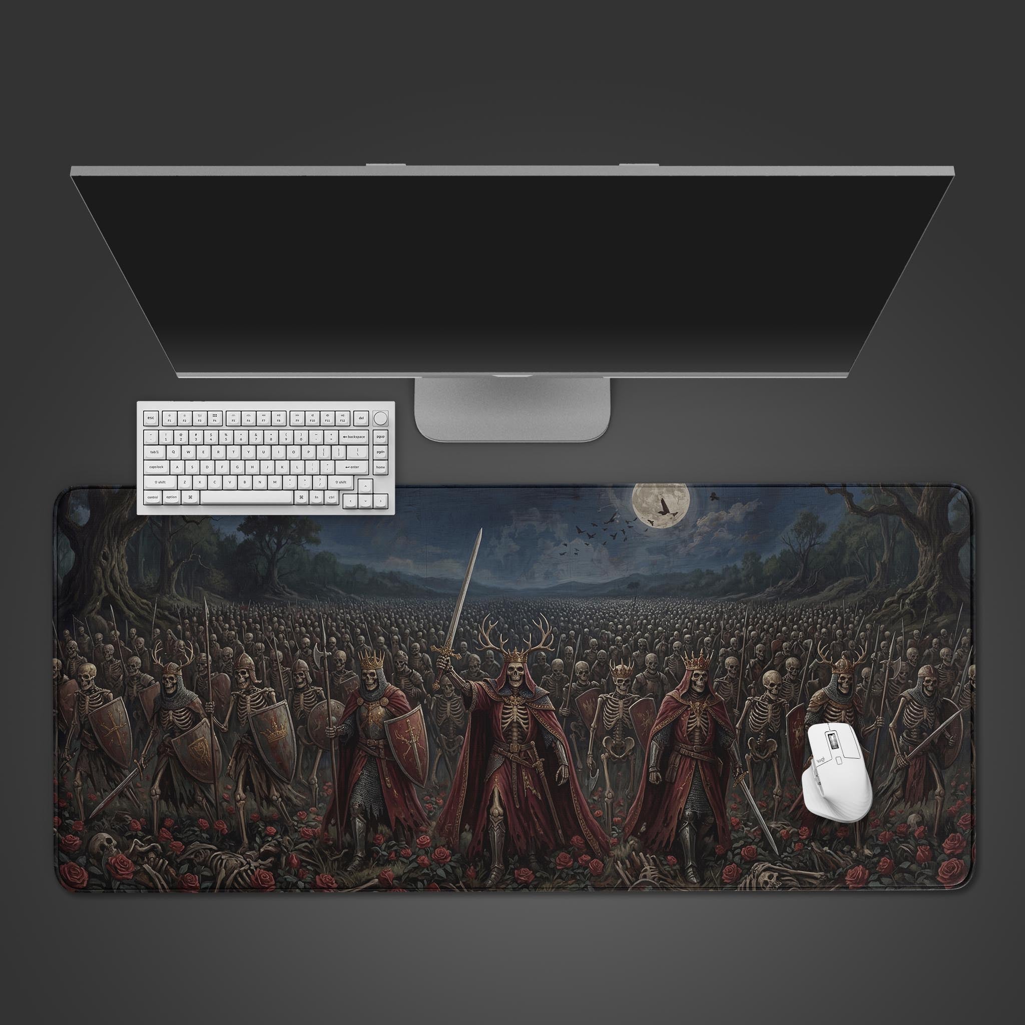 Top-down view of the Undead Rose Army gaming desk mat, showing the dark fantasy skeleton art under a sleek monitor, white keyboard, and mouse. - Epic Design Pads & Mousepads