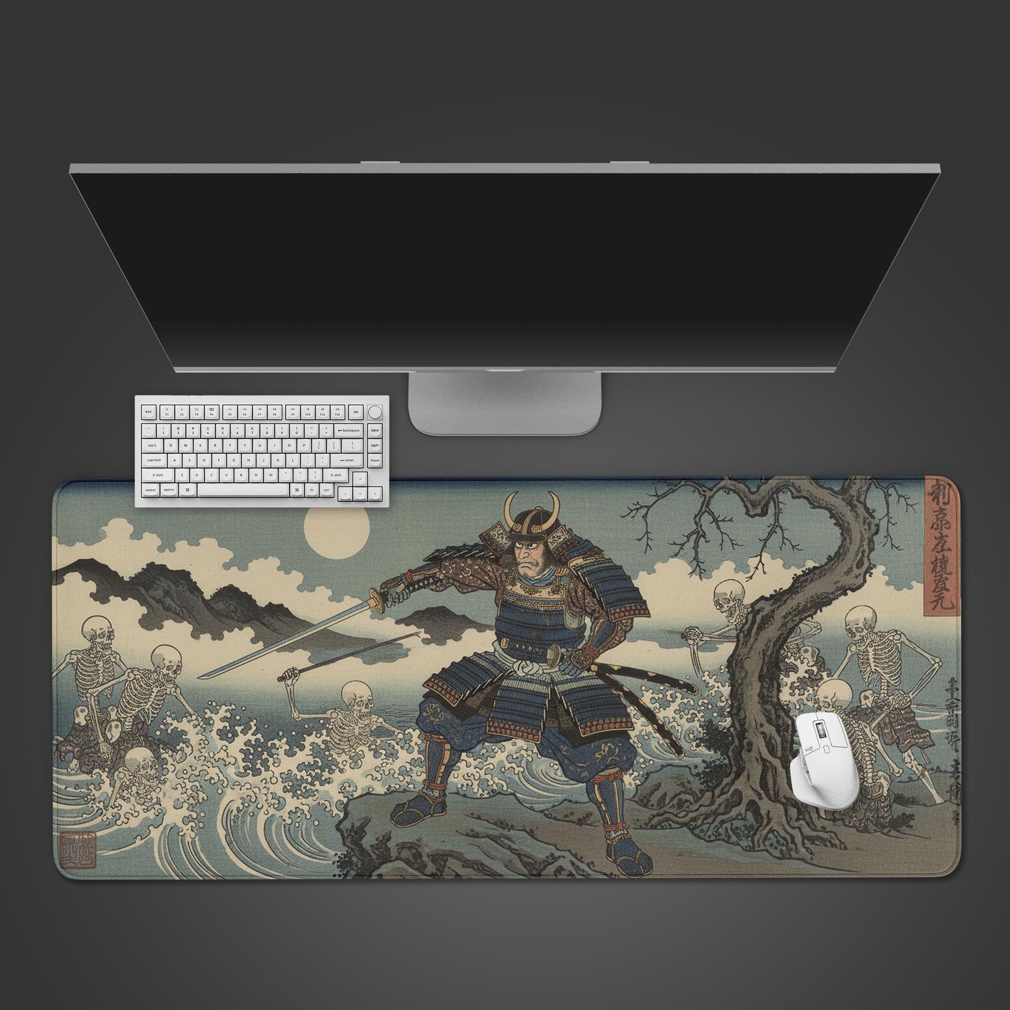 Undead Siege samurai gaming desk mat featuring Japanese ukiyo-e art of a warrior fighting skeletons, shown with a keyboard and mouse. - Epic Design Pads