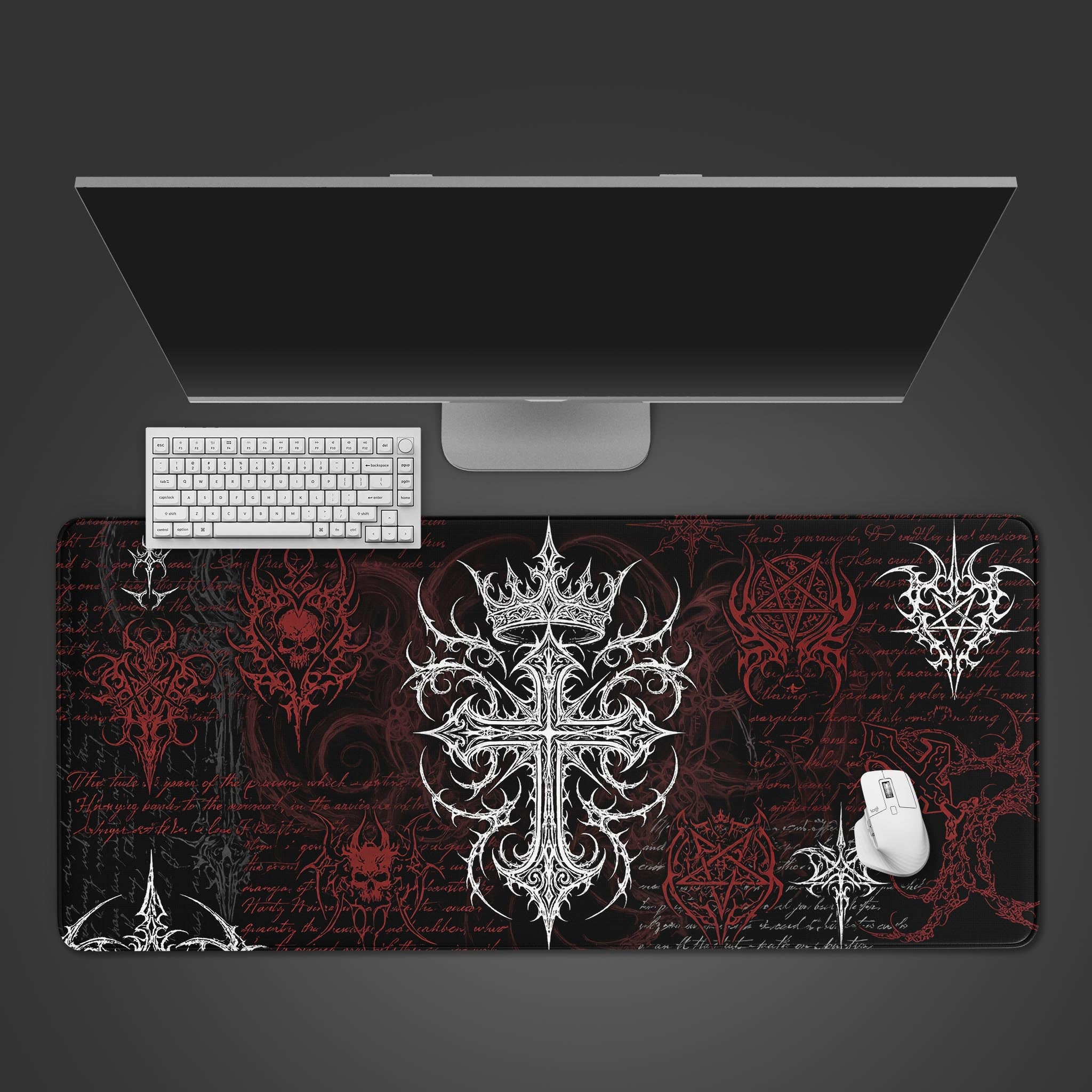 The Vanquished Cross gaming desk mat shown from above, with a white keyboard and mouse on its intricate gothic cross and red sigil design. - Epic Design Pads & Mousepads