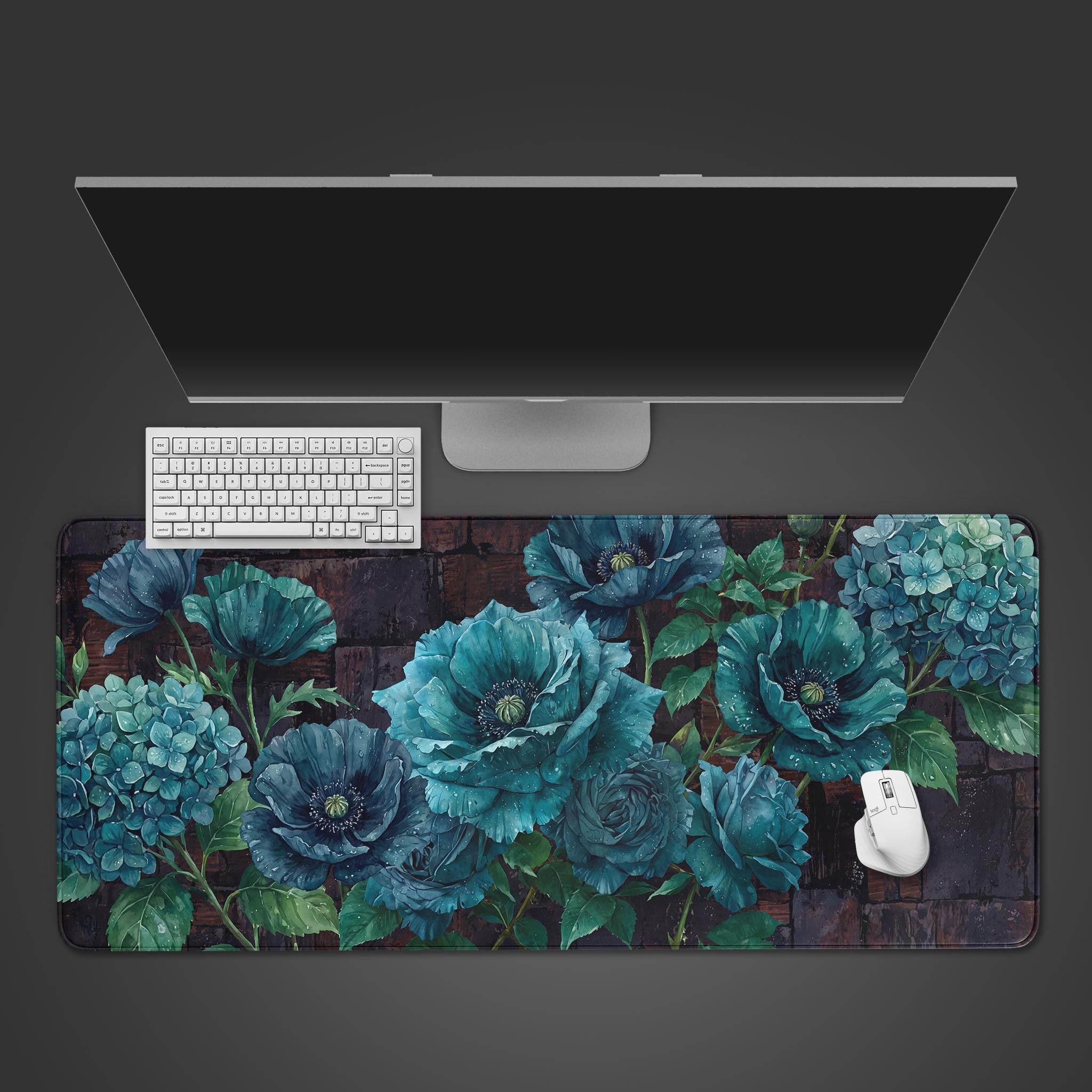 A top-down view of the Velvet Bloom floral gaming desk mat, shown with a white keyboard, mouse, and a large monitor on a dark gray surface. - Epic Design Pads & Mousepads