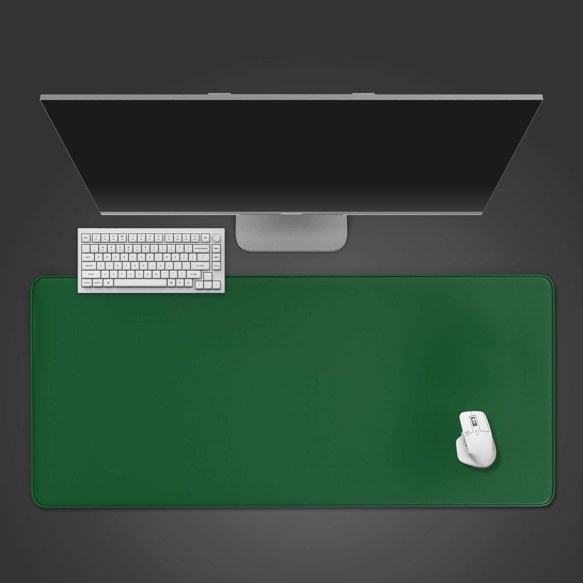 A top-down view of the Verdant Deep green gaming desk mat, with a white keyboard and mouse neatly arranged on it below a sleek monitor. - Epic Design Pads & Mousepads