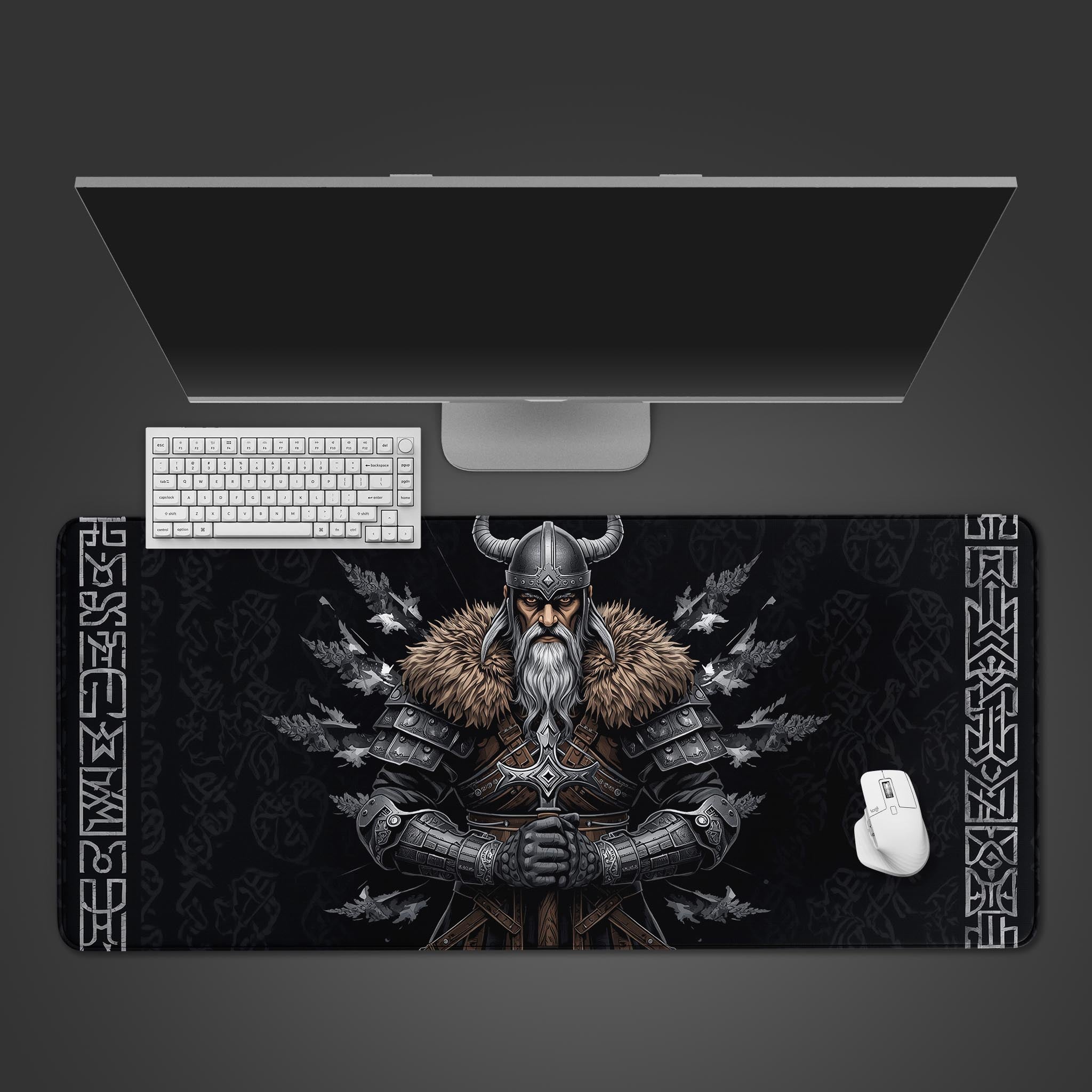 Viking Oath desk mat featuring an elder warrior design, shown on a desk with a keyboard and mouse from a top-down view. - Epic Design Pads