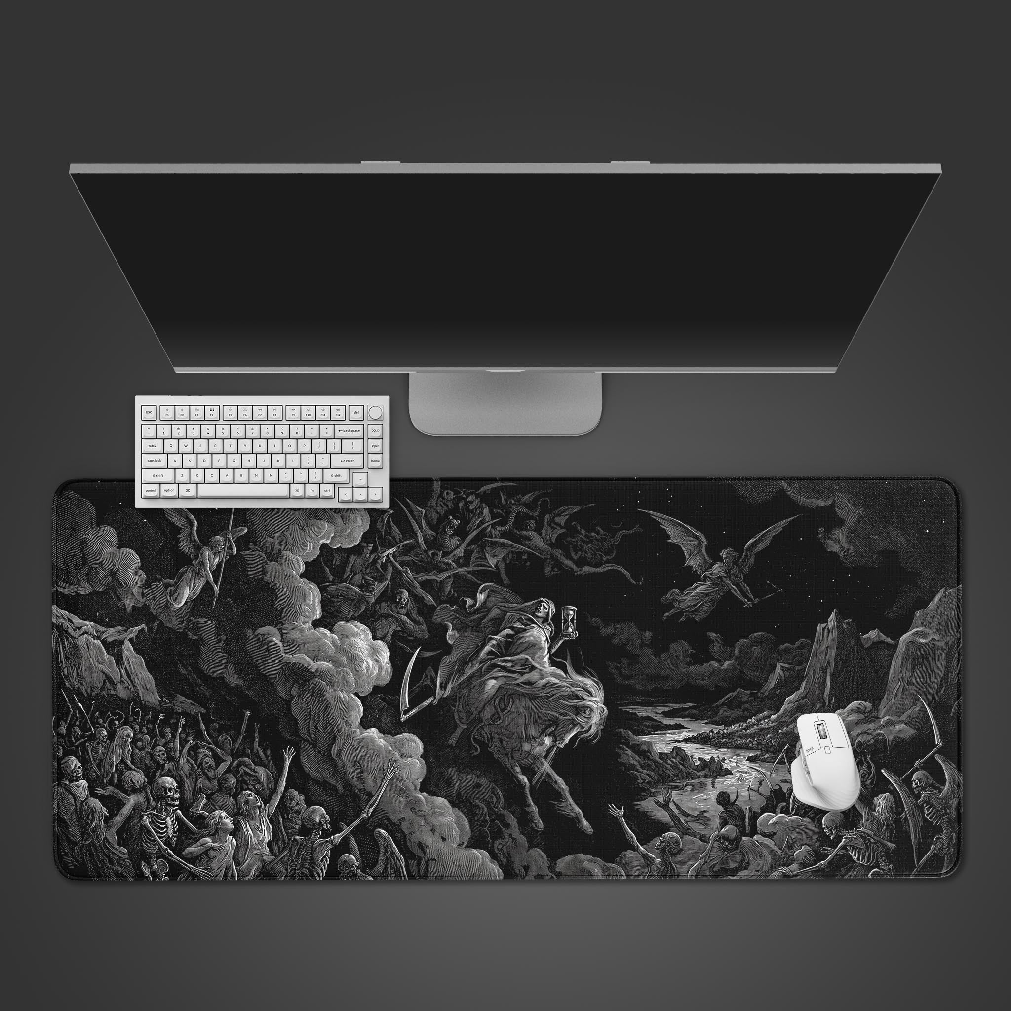 Top-down view of the Vision of Death gaming desk mat. A white keyboard and mouse are placed on the intricate black and white apocalyptic artwork below a monitor. - Epic Design Pads & Mousepads