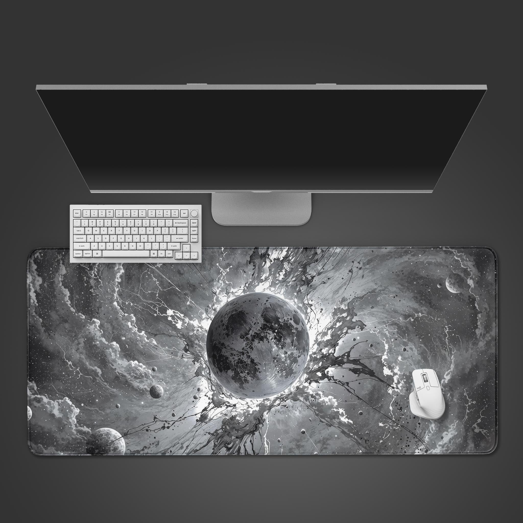 Void Burst monochrome desk mat showing a cosmic explosion design. Top-down view on a desk with a black mechanical keyboard and gaming mouse. - Epic Design Pads & Mousepads