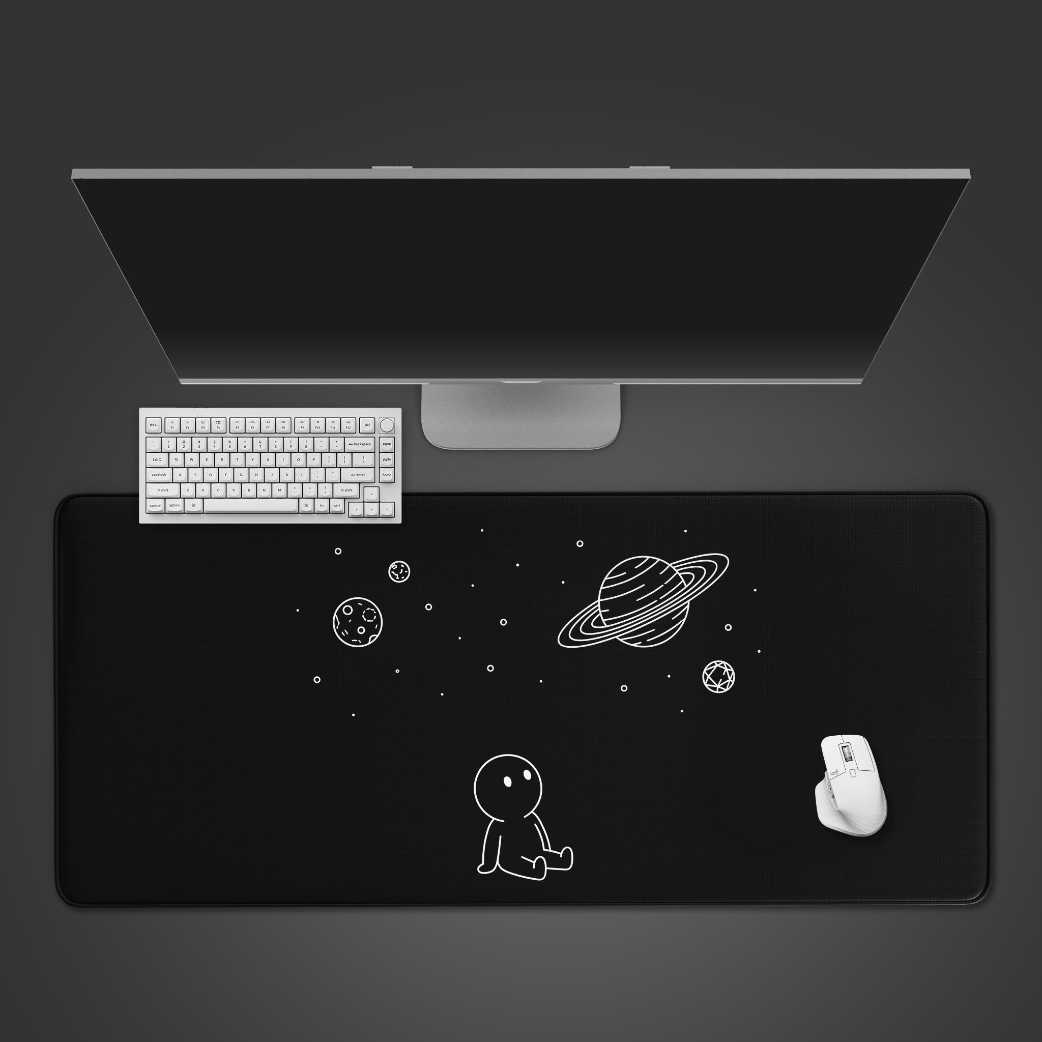 Top-down view of the Void Watcher gaming desk mat. The minimalist space design is shown with a white keyboard and mouse, creating a clean, monochrome setup on a dark surface. - Epic Design Pads & Mousepads