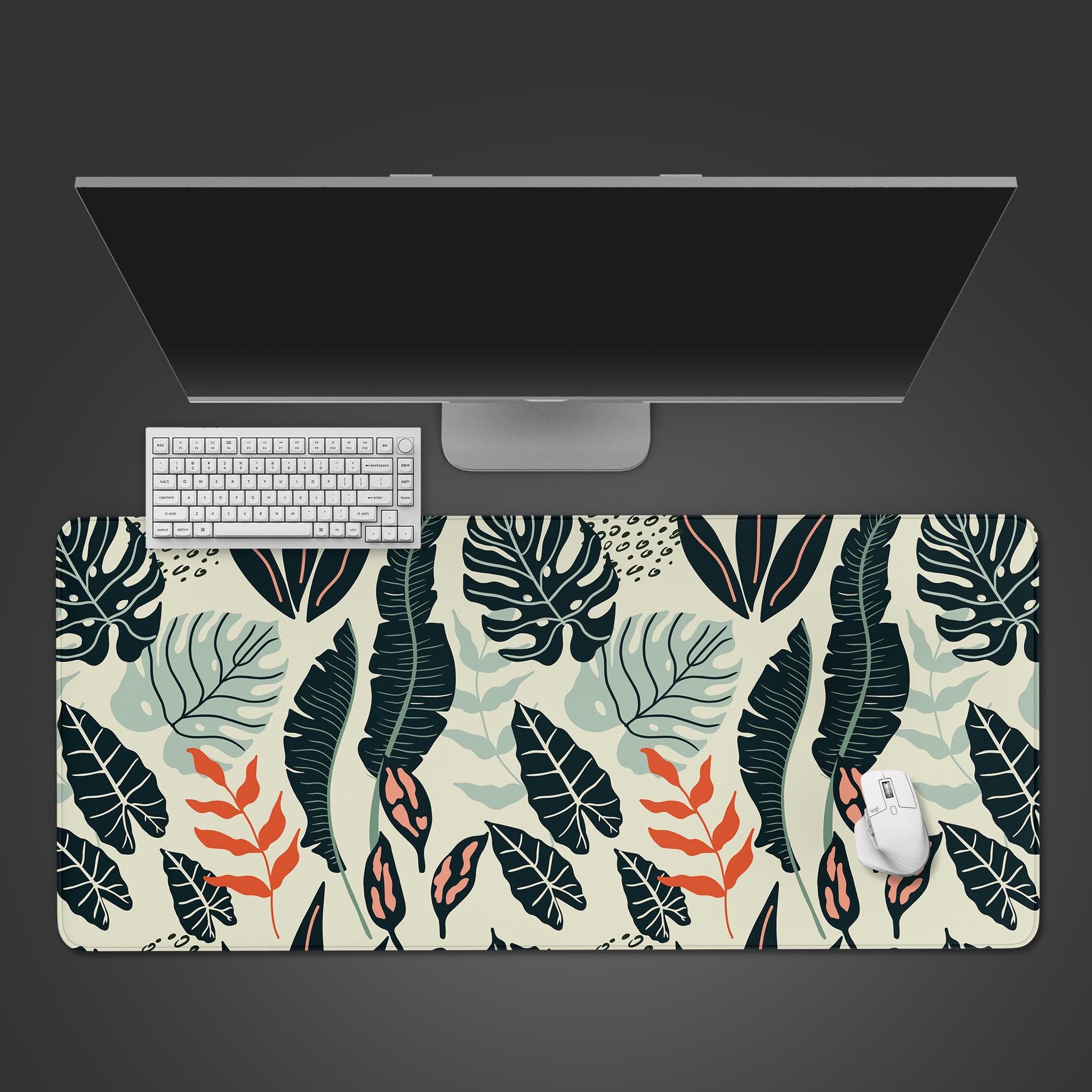 Wild Botanical Desk Mat with a modern tropical leaf design, shown in a top-down view with a minimalist keyboard and mouse. - Epic Design Pads