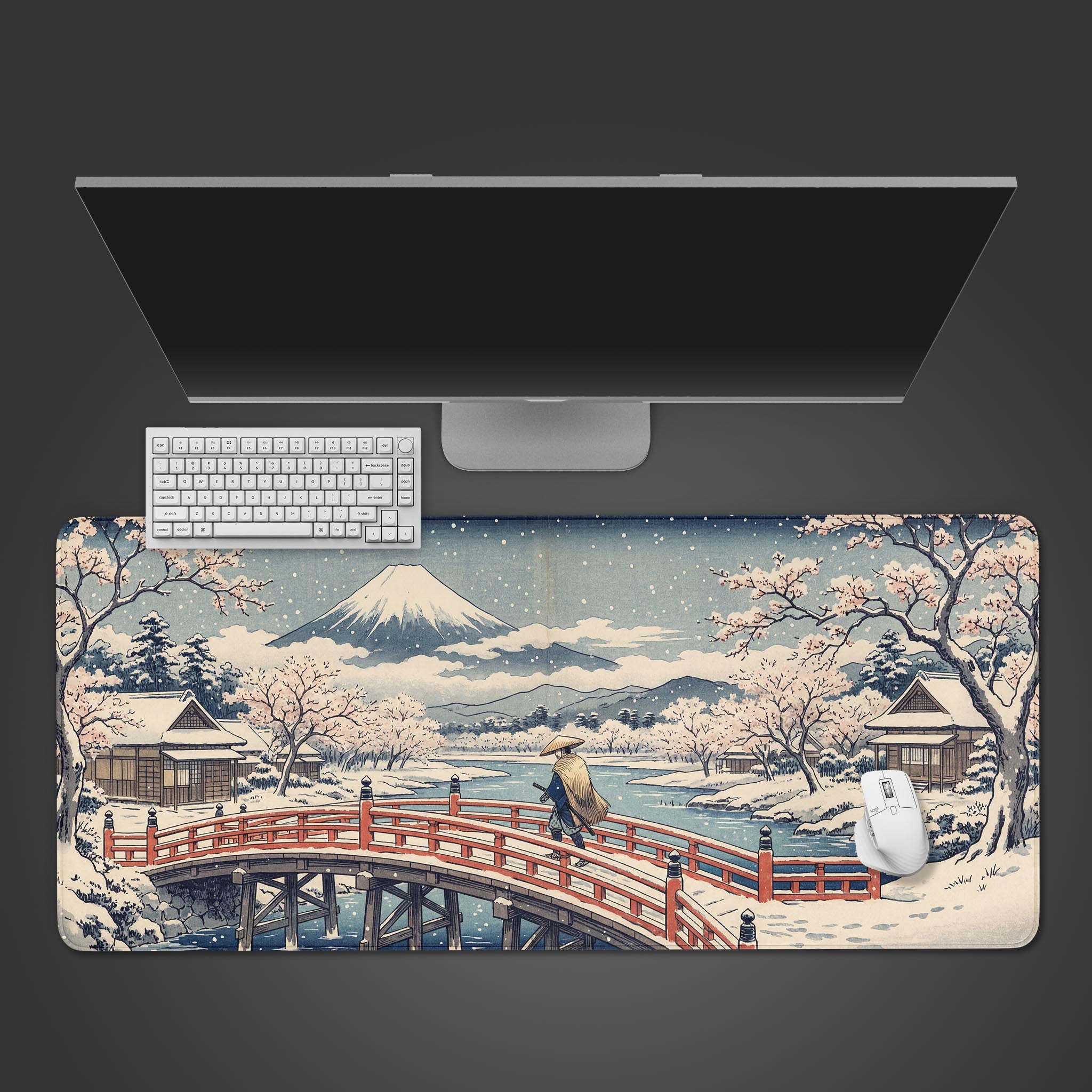 A top-down view of the Winter Zen Path gaming desk mat, featuring a Japanese Ukiyo-e winter scene, arranged with a white mechanical keyboard, a white mouse, and a sleek monitor. - Epic Design Pads & Mousepads