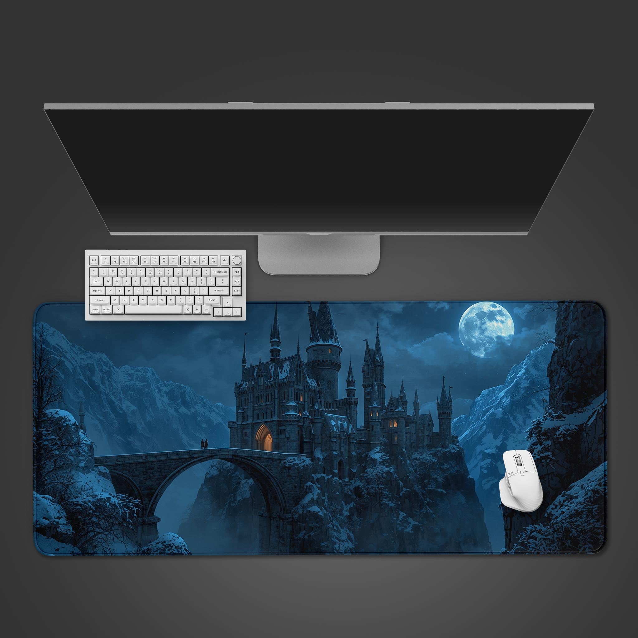 Gothic fantasy desk mat with a snowy Winterhold Castle design – top-down view on a desk with a gaming keyboard and mouse. - Epic Design Pads