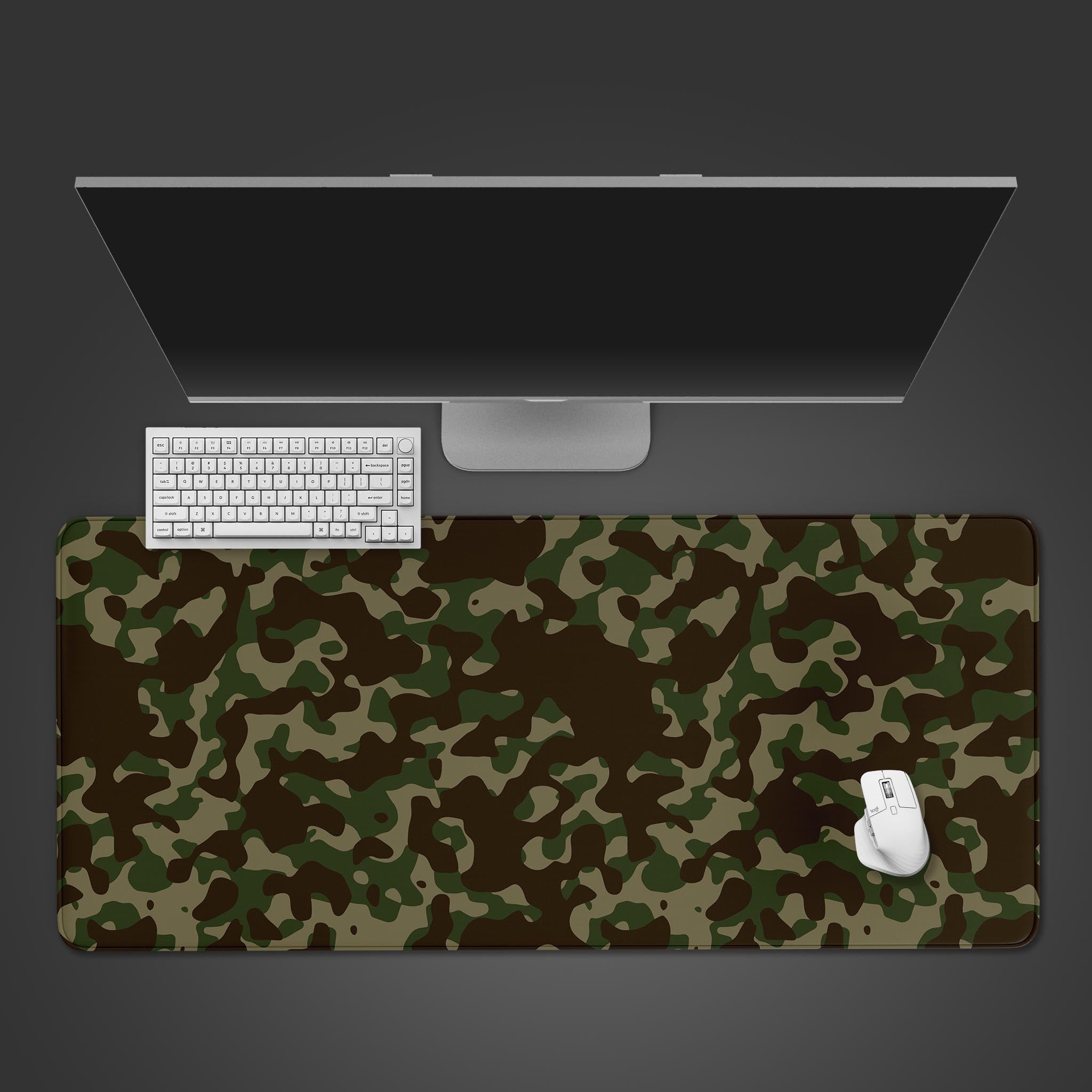 Woodland Camo desk mat with its classic forest pattern, shown in a top-down desktop view with a black keyboard and gaming mouse. - Epic Design Pads