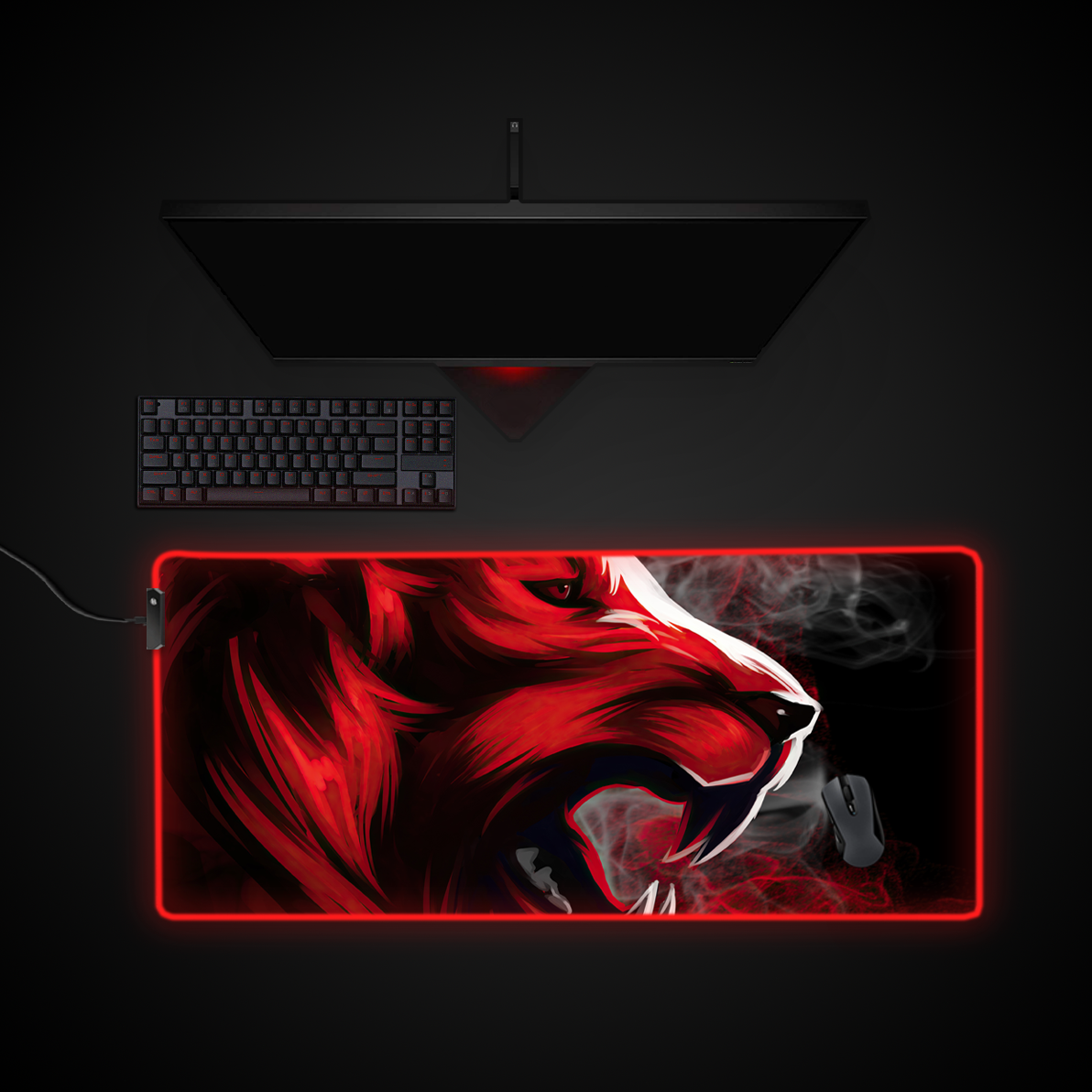 Gaming setup with a large custom mouse pad featuring a red and black lion design on a dark background.