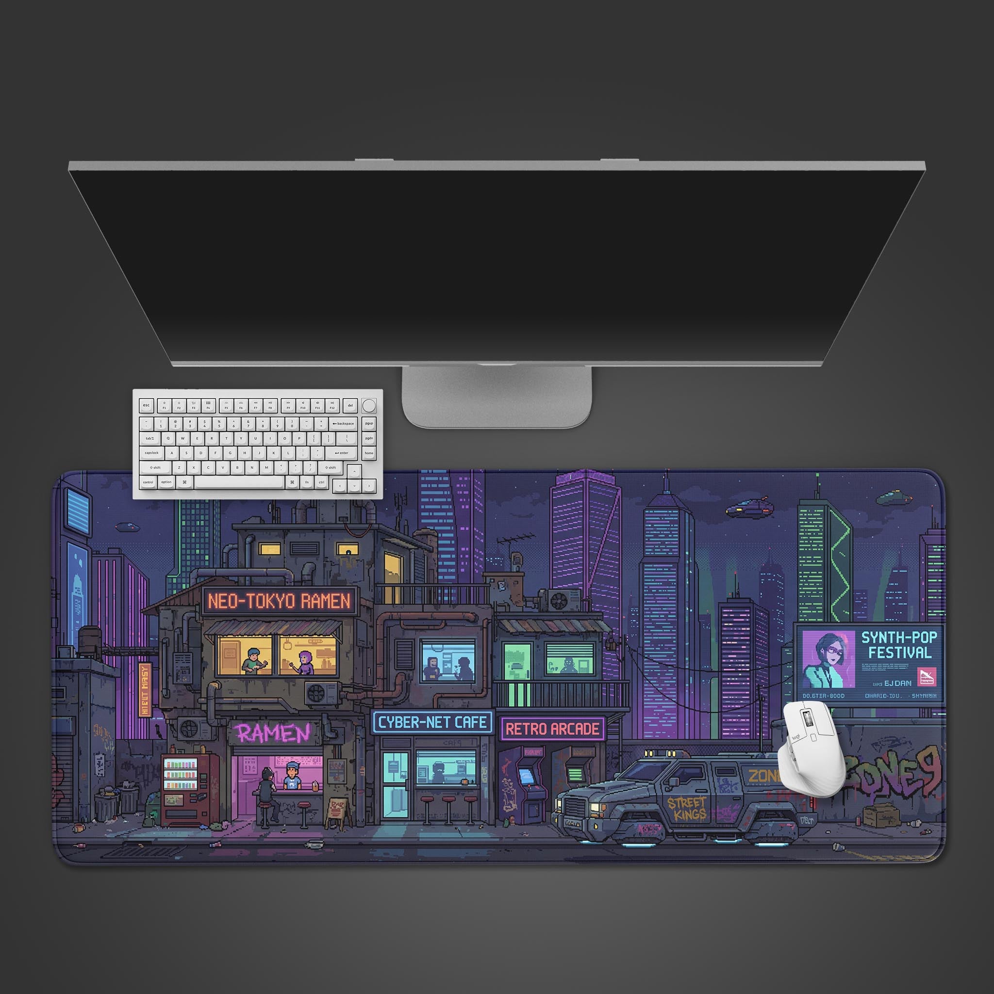 A top-down view of the Zone Nine gaming desk mat, showing its cyberpunk pixel art city design underneath a sleek monitor, white keyboard, and mouse. - Epic Design Pads & Mousepads