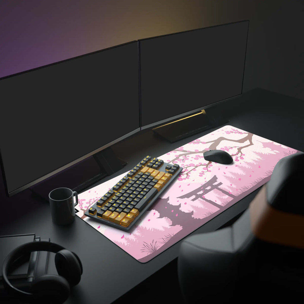 Sakura Desk Pad in a dark gaming setup with a mechanical keyboard, a mouse and headphones