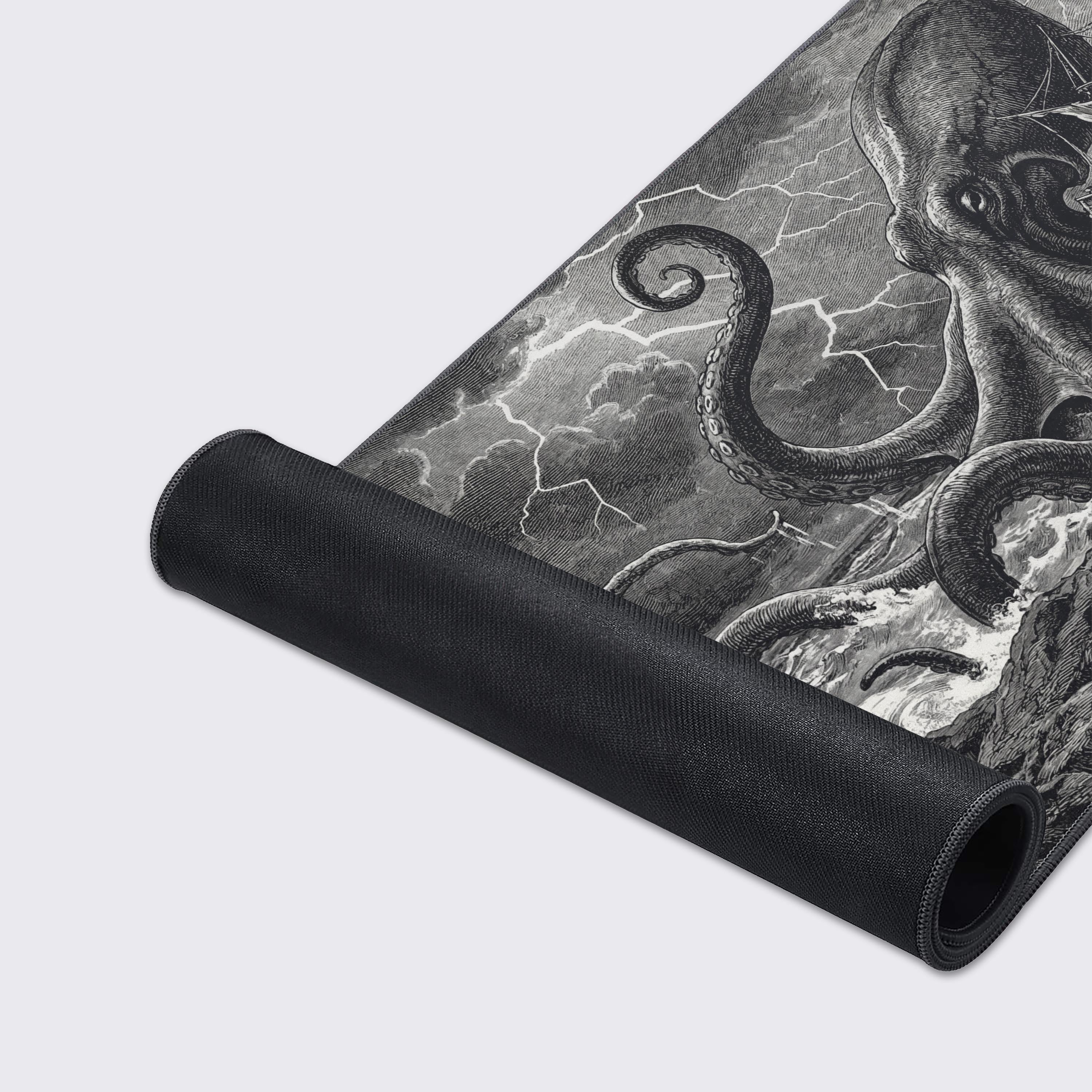Close-up of the Leviathan's Wrath gaming desk mat, highlighting the detailed vintage engraving art and durable stitched edges on the smooth fabric surface. - Epic Design Pads & Mousepads