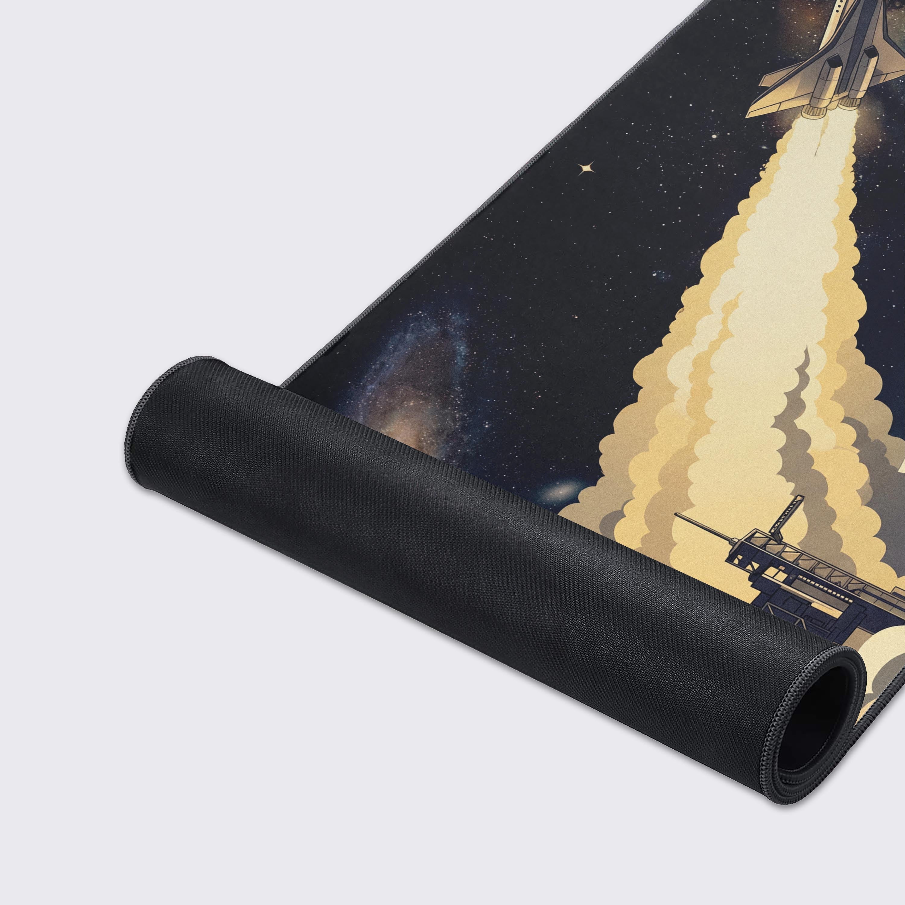 Close-up of the Cosmic Launch gaming desk mat's smooth fabric texture and stitched edges, showcasing the detailed rocket launch and galaxy artwork. - Epic Design Pads & Mousepads
