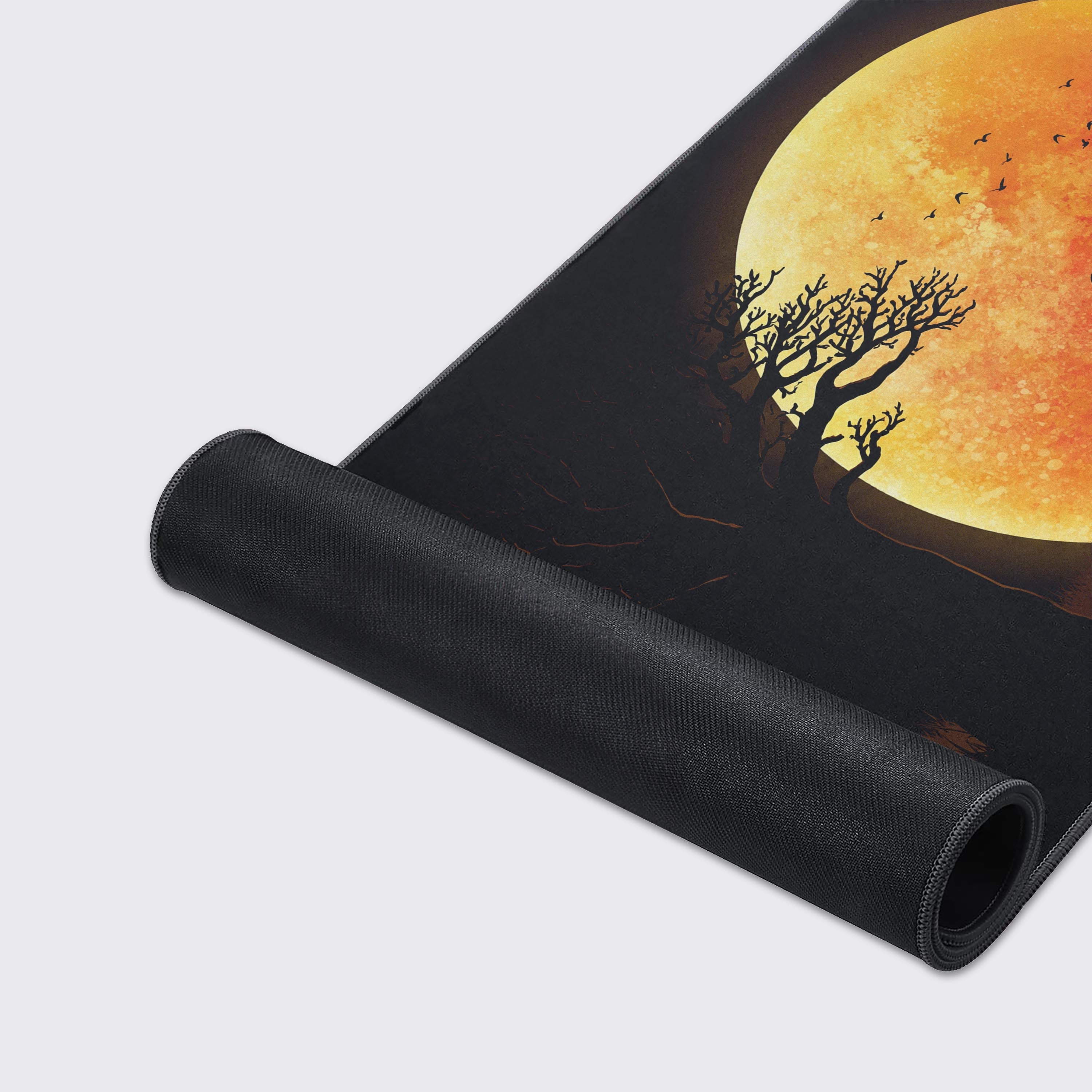 Close-up of the Golden March gaming desk mat, highlighting the smooth texture, stitched edges, and the detailed silhouette of elephants. - Epic Design Pads & Mousepads