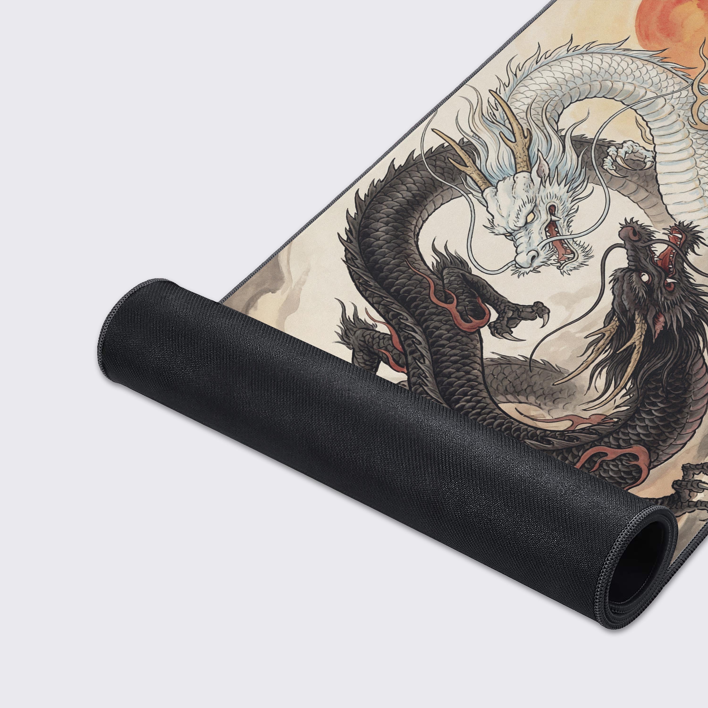 Close-up of the Japanese ink wash dragon design on the smooth, textured surface of the Celestial Duality Gaming Desk Mat, highlighting the quality stitched edges. - Epic Design Pads & Mousepads