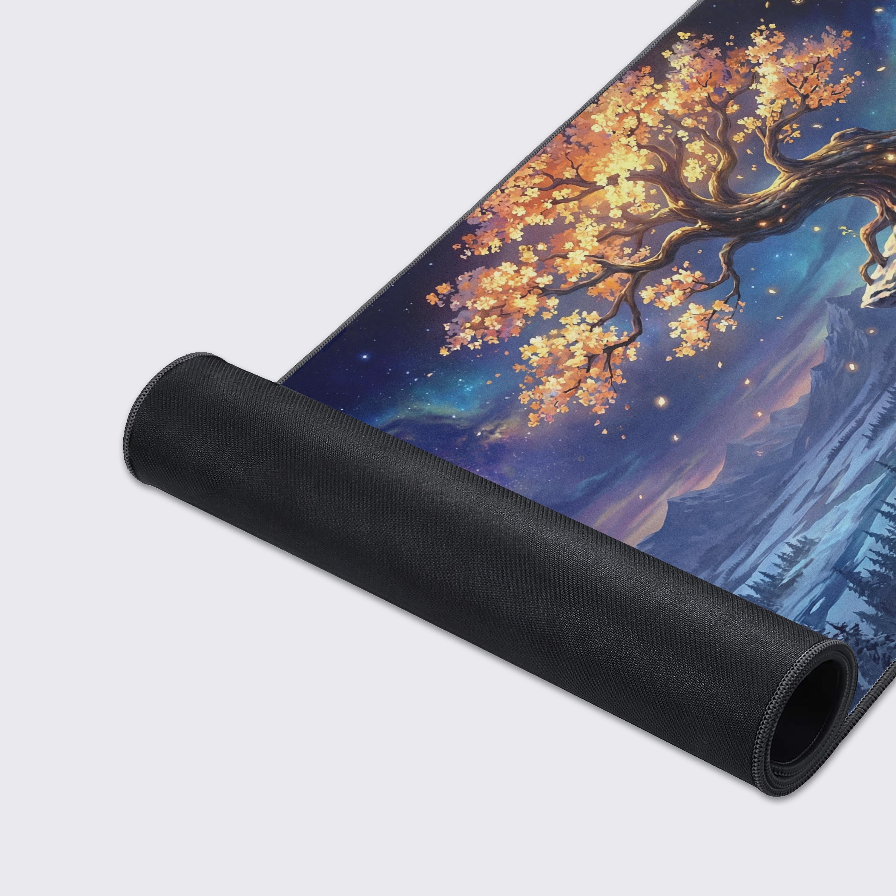 A close-up of the Golden Solstice gaming desk mat, highlighting the smooth fabric texture, stitched edges, and the vibrant art of a magical glowing tree. - Epic Design Pads & Mousepads