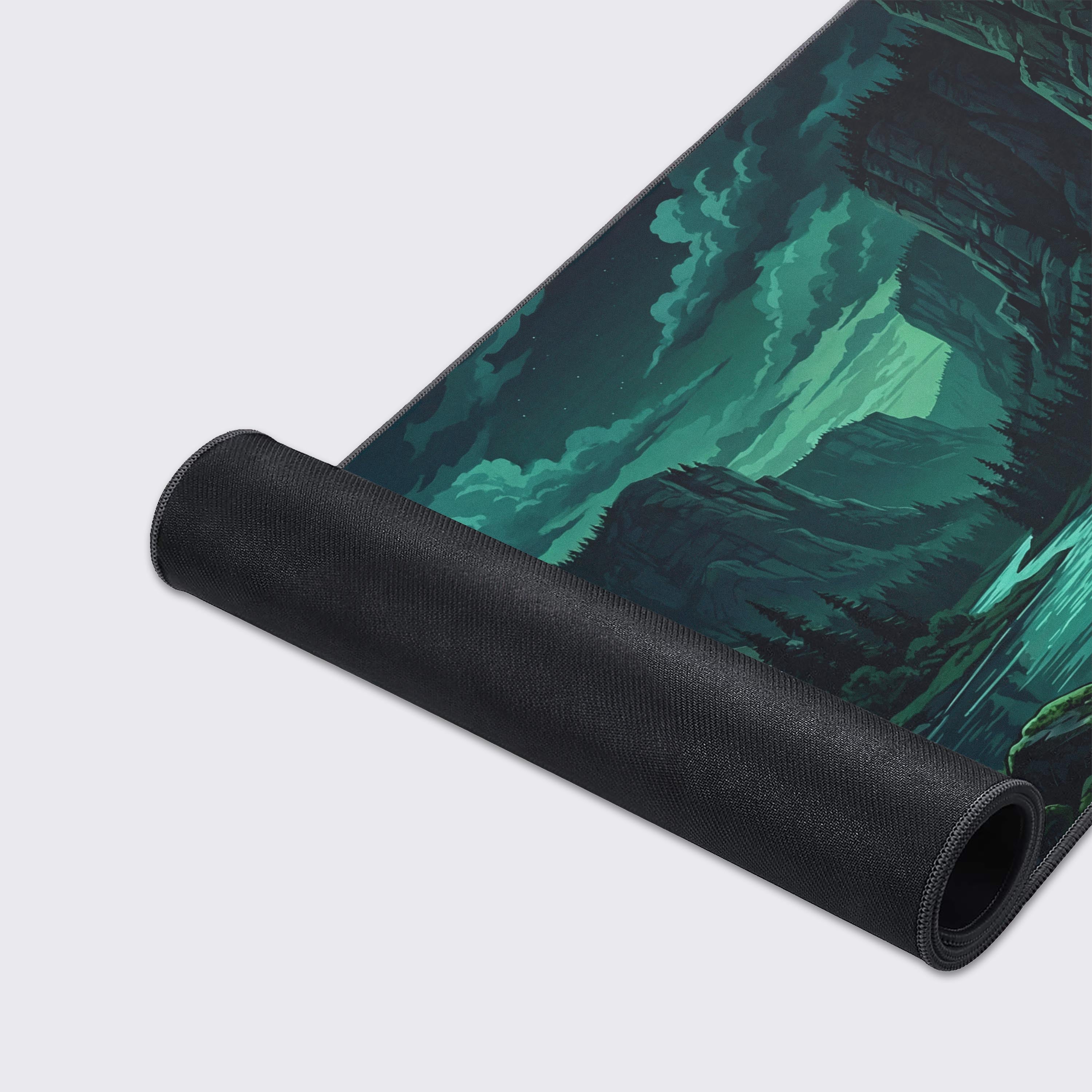 Close-up of the Silent Gorge gaming desk mat showing the detailed forest artwork, smooth fabric texture, and durable anti-fray stitched edges. - Epic Design Pads & Mousepads