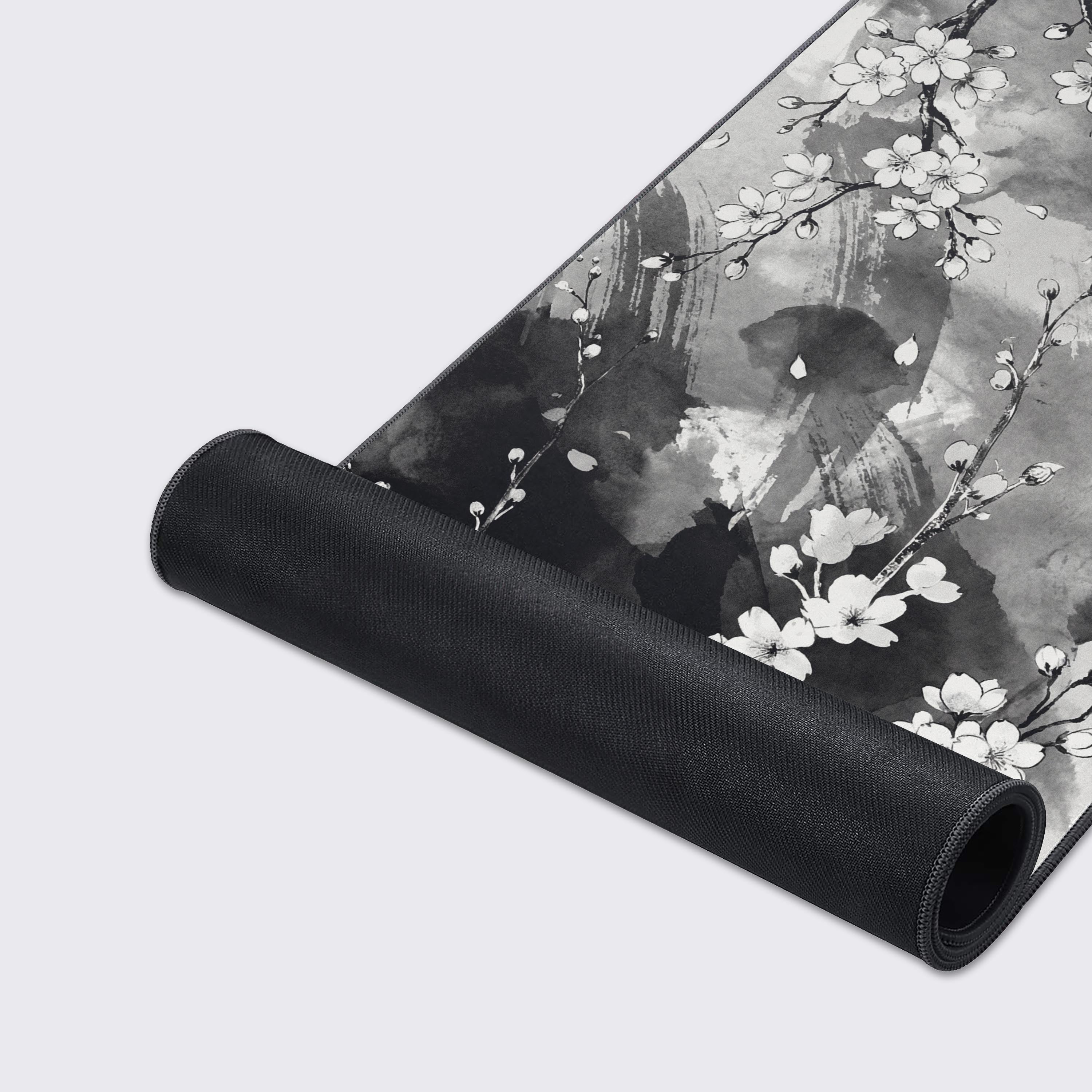 Close-up of the Silent Sakura Mouse Pad's high-quality stitched edges and smooth fabric texture, showcasing the detailed Sumi-e cherry blossom artwork. - Epic Design Pads & Mousepads