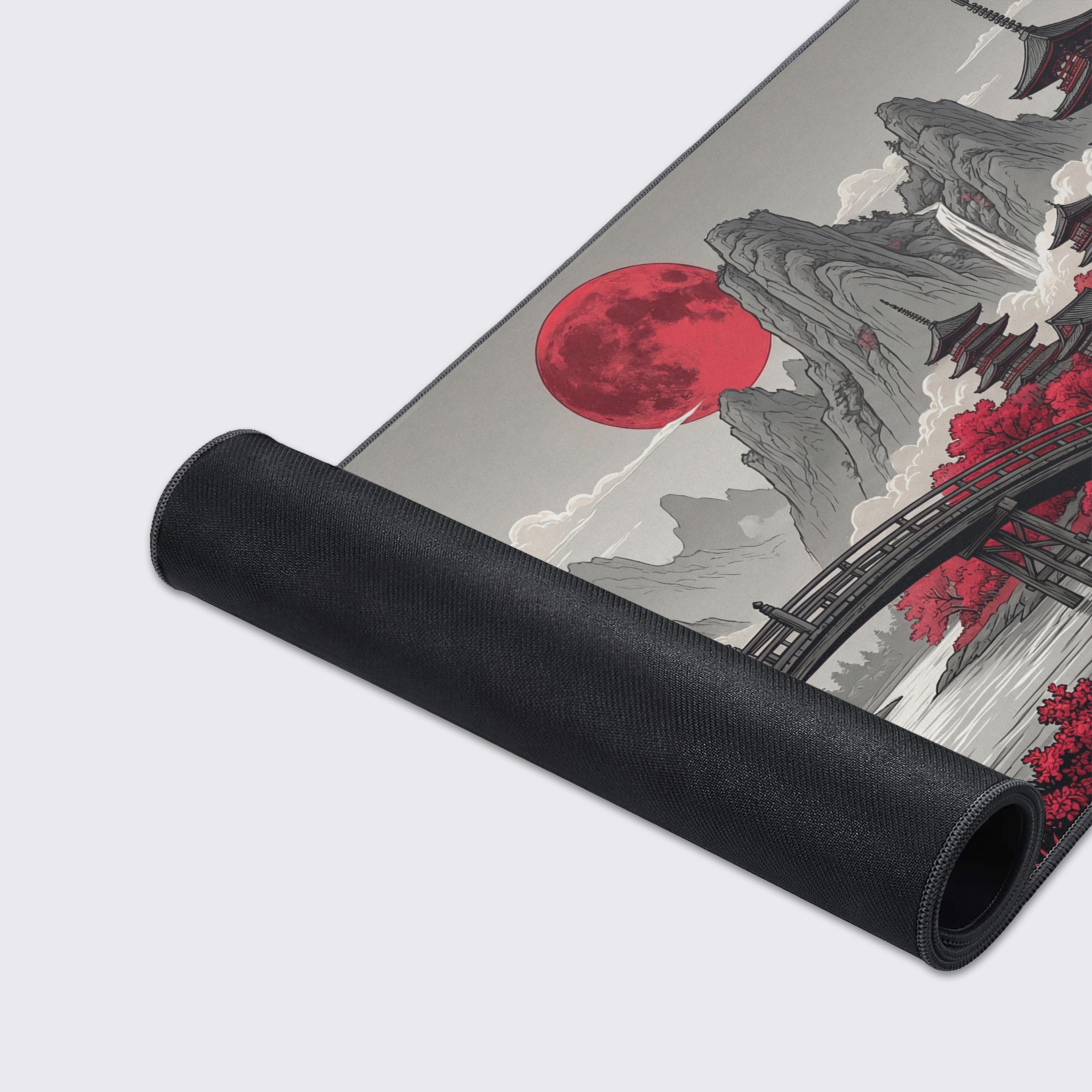 A close-up view of the Scarlet Moon mouse pad highlighting the quality stitched edges and smooth fabric texture of the Japanese landscape design. - Epic Design Pads & Mousepads