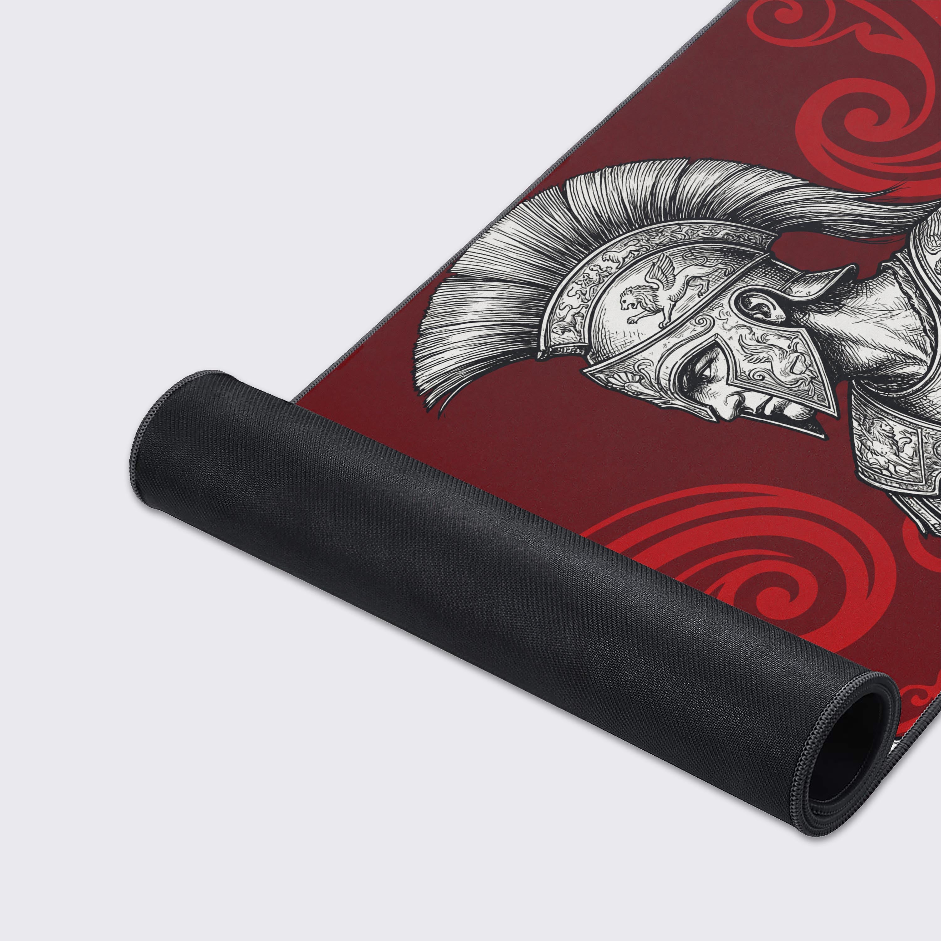 A close-up of the Spartan Resolve gaming desk mat highlights its durable stitched edges and smooth fabric texture, showcasing the intricate line art of the warrior's armor. - Epic Design Pads & Mousepads