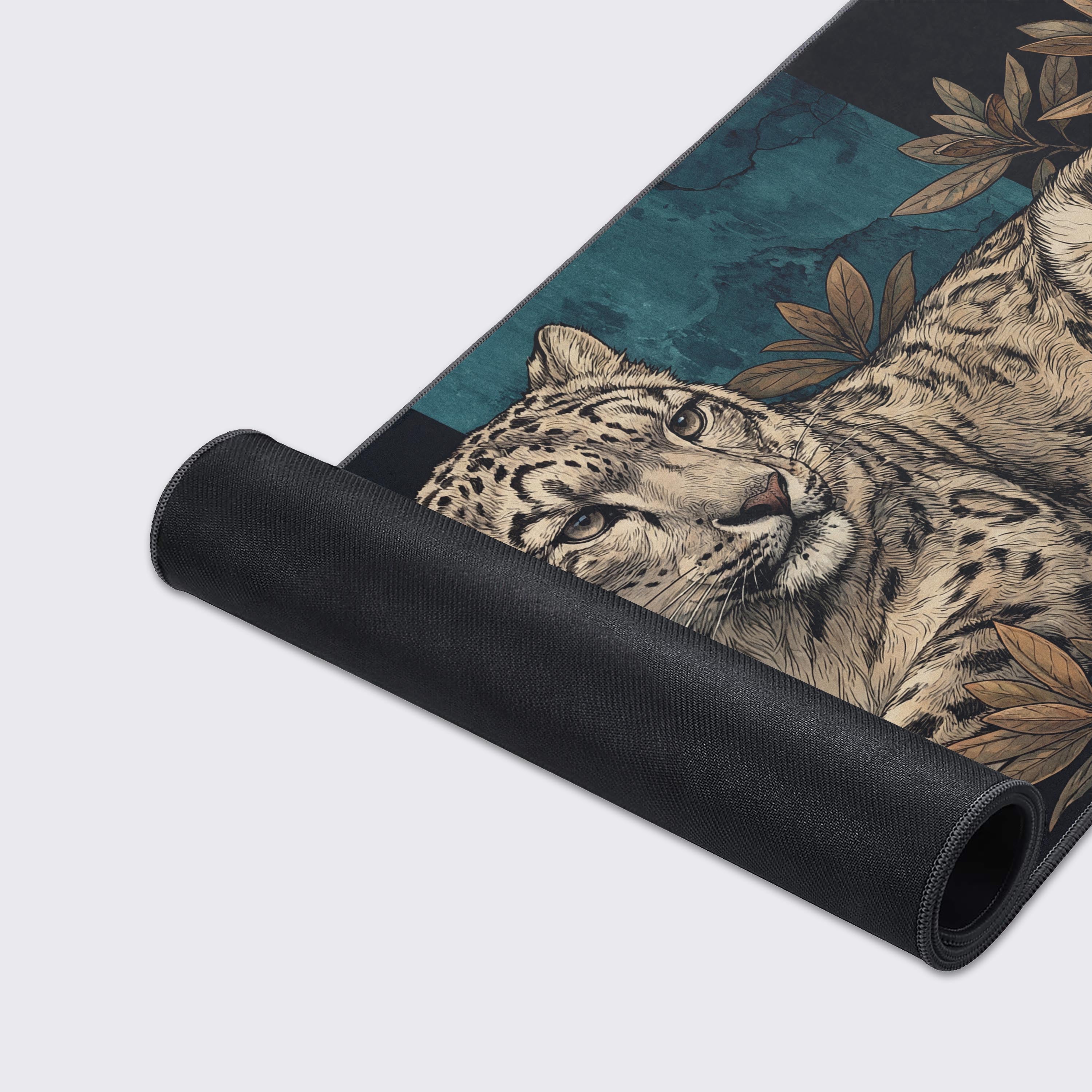 Close-up shot of the Alpine Ghost gaming desk mat showcasing the high-quality fabric texture, stitched edges, and detailed snow leopard artwork. - Epic Design Pads & Mousepads