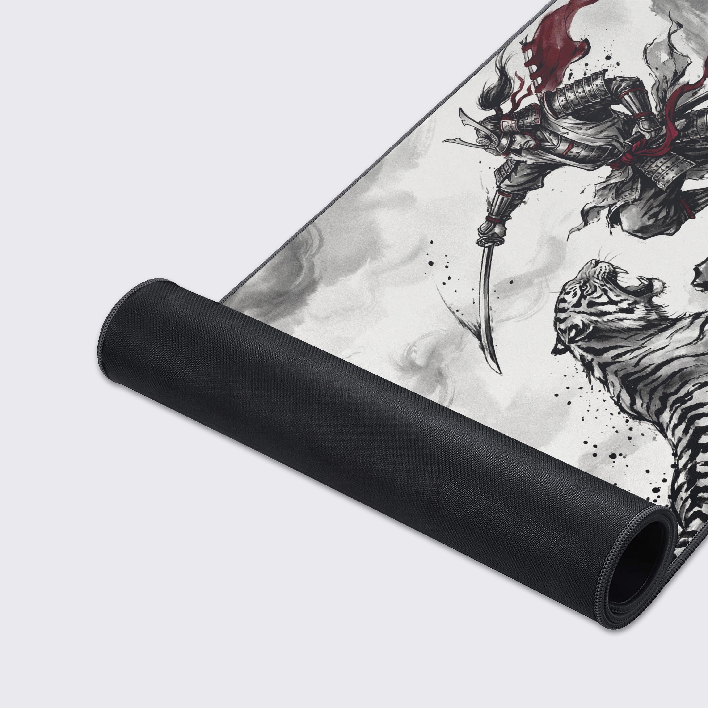 Close-up of the Taming Chaos mouse pad's smooth texture and durable stitched edges, highlighting the detailed Sumi-e artwork of the samurai and tiger. - Epic Design Pads & Mousepads