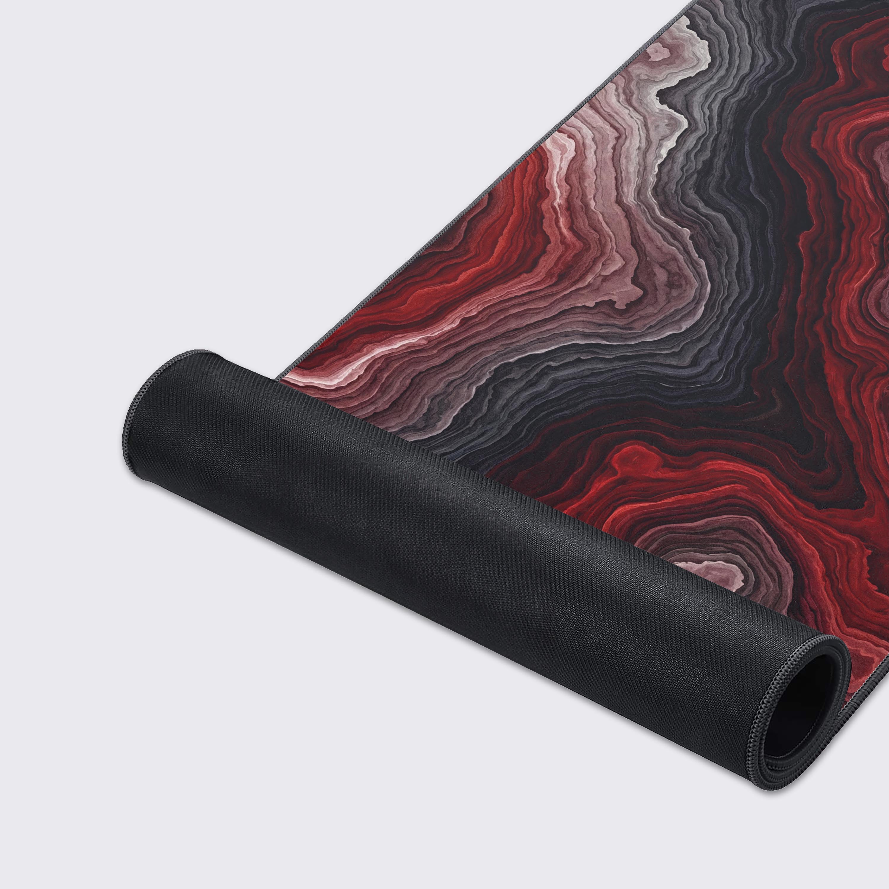 A close-up of the Crimson Strata mouse pad, highlighting the detailed abstract design, smooth fabric texture, and durable stitched edges for long-lasting use. - Epic Design Pads & Mousepads
