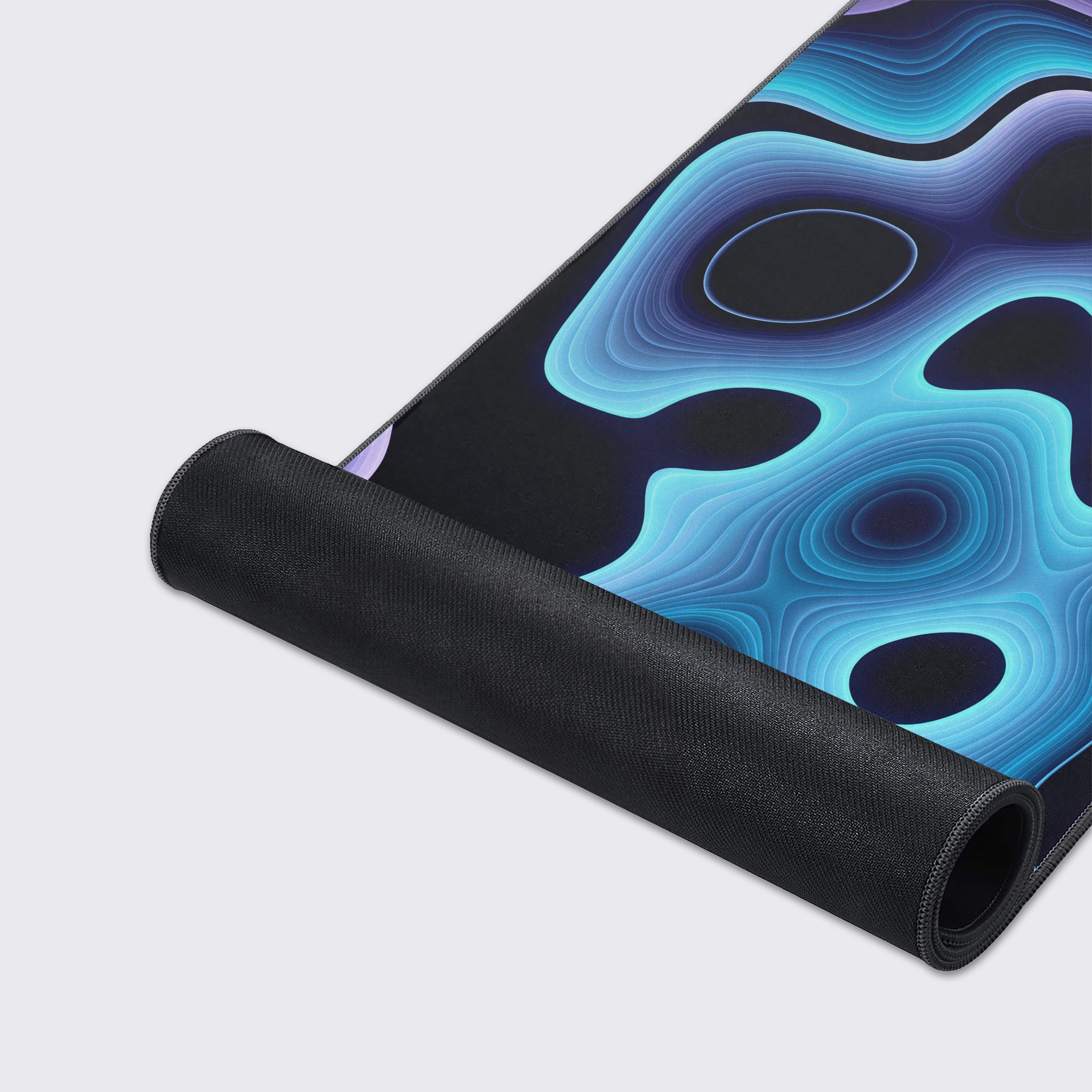 Close-up of the Sonic Depth mouse pad's premium fabric texture and durable stitched edges, highlighting the intricate, layered design of cyan and violet waves. - Epic Design Pads & Mousepads