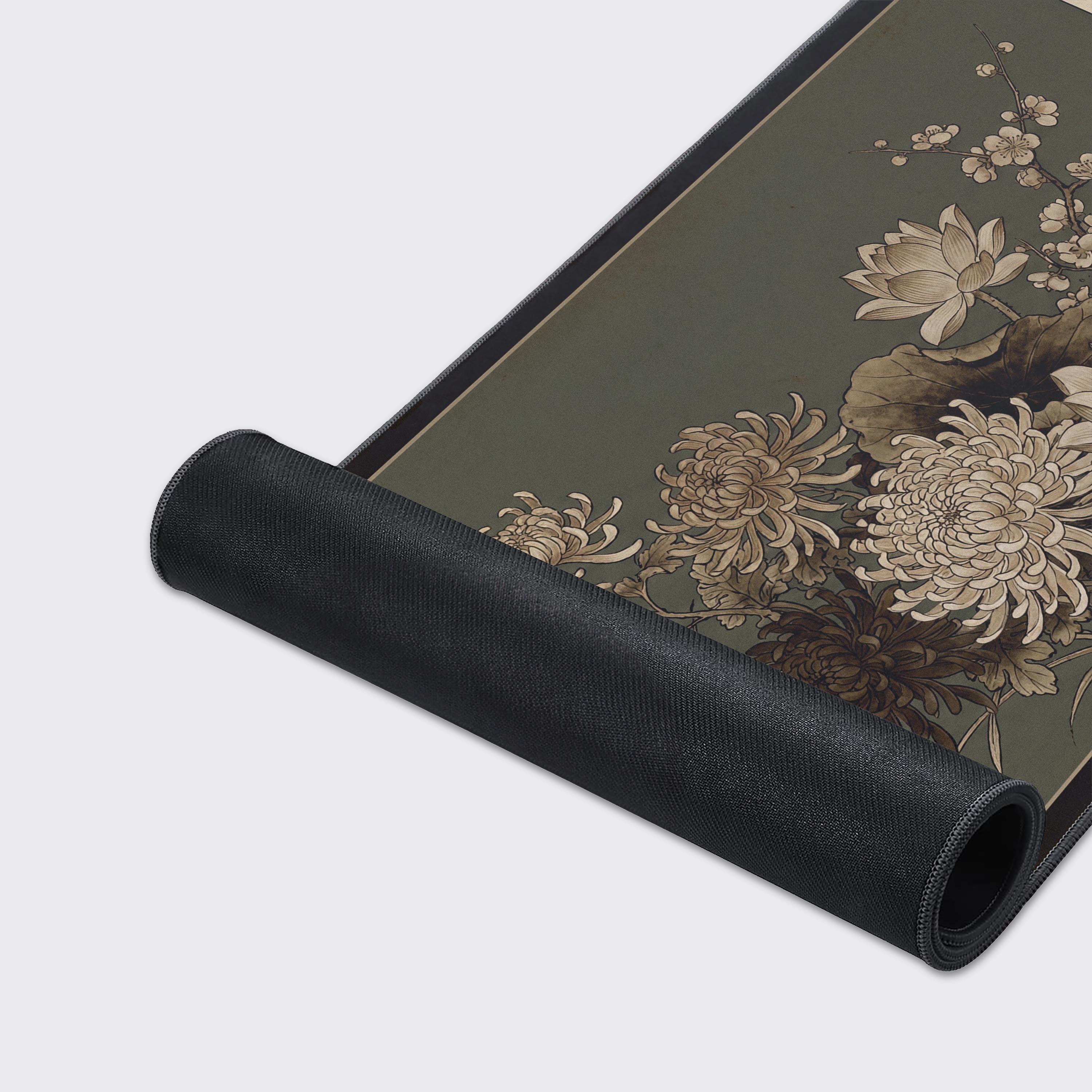 Close-up of the Antique Bloom gaming desk mat, highlighting the detailed ink wash floral artwork and the high-quality stitched edges on the smooth fabric surface. - Epic Design Pads & Mousepads