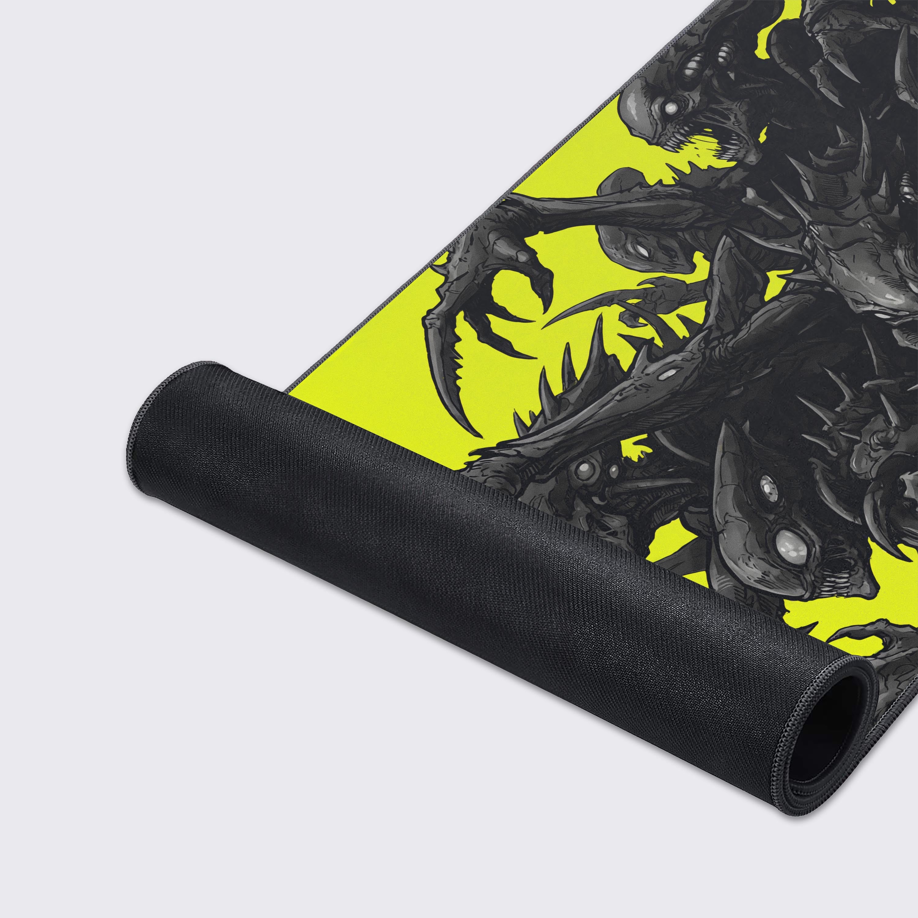 A close-up of the Void Hunters mouse pad, highlighting the durable stitched edges and smooth fabric texture of the aggressive biomechanical alien design. - Epic Design Pads & Mousepads