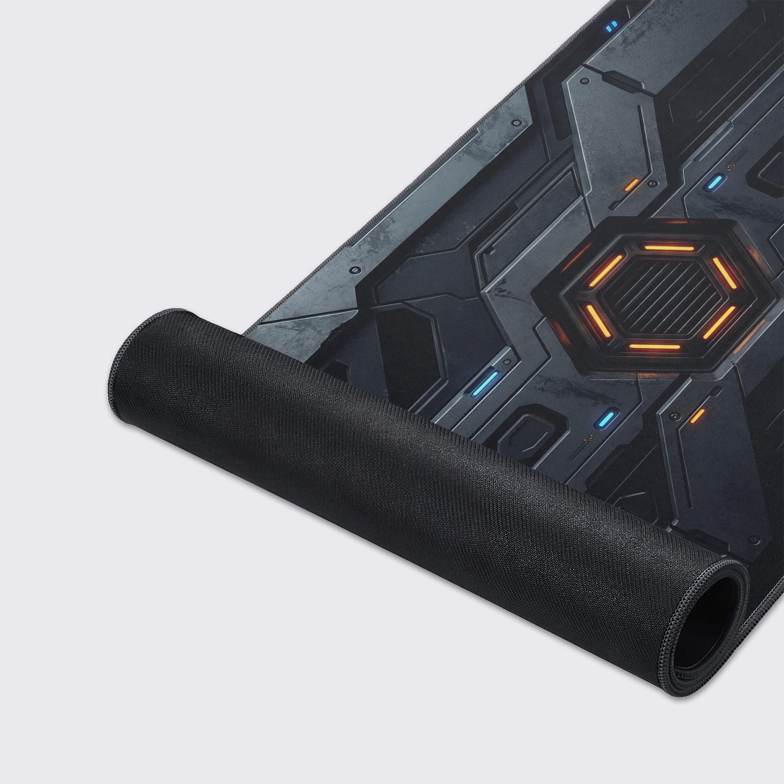 Close-up of the Core Reactor gaming desk mat, highlighting the high-quality fabric texture, anti-fray stitched edges, and detailed futuristic plating design. - Epic Design Pads & Mousepads
