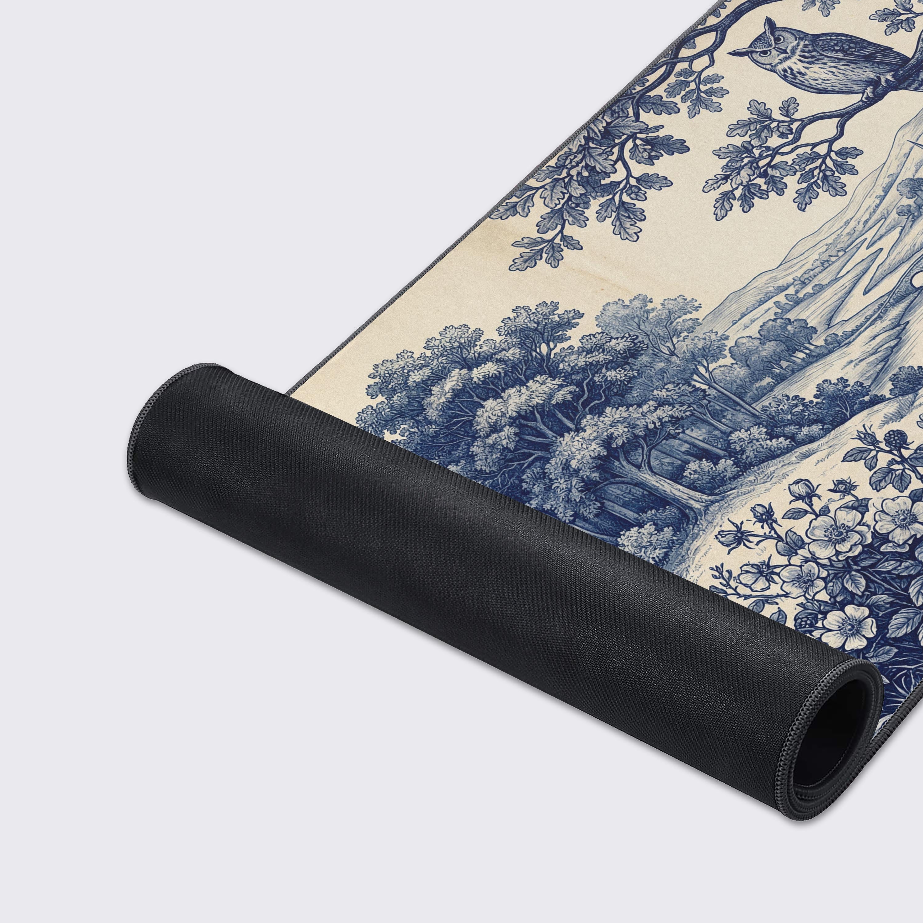Close-up of the Foxwood Toile gaming desk mat, highlighting the durable stitched edges and detailed print of the forest and animal illustration. - Epic Design Pads & Mousepads