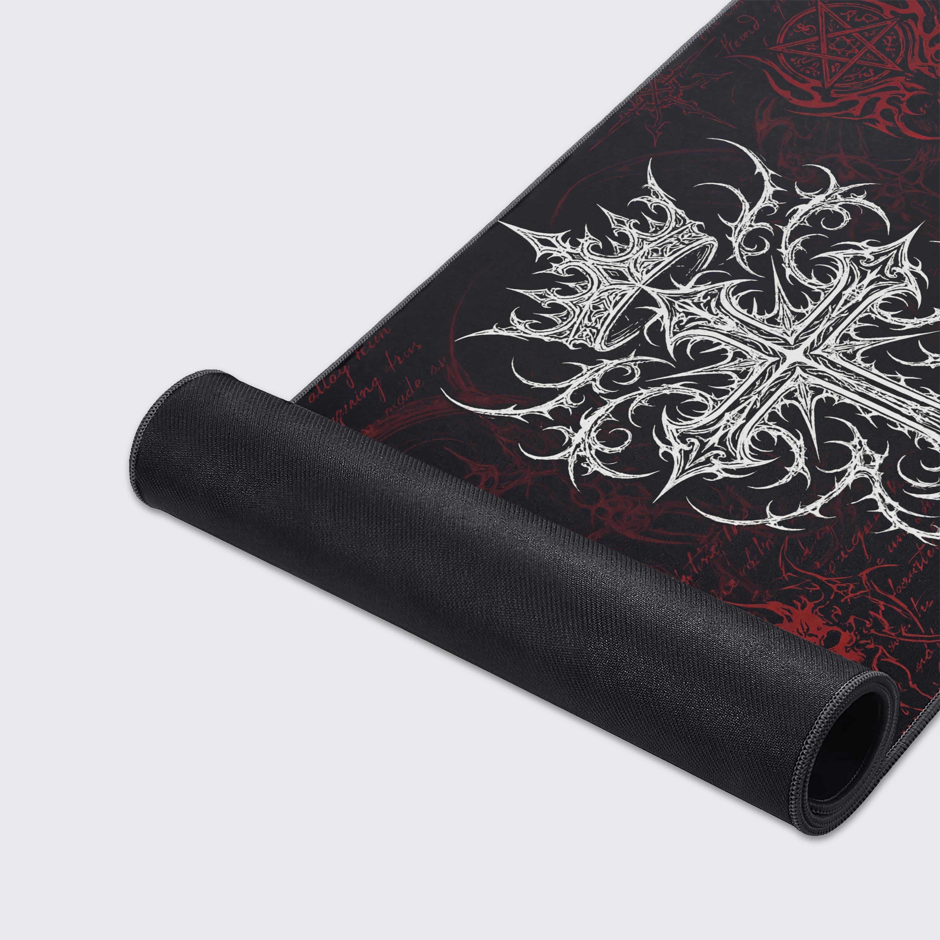 A close-up of the Vanquished Cross gaming desk mat, highlighting the durable stitched edges, smooth texture, and the detailed bone-white crowned cross design. - Epic Design Pads & Mousepads