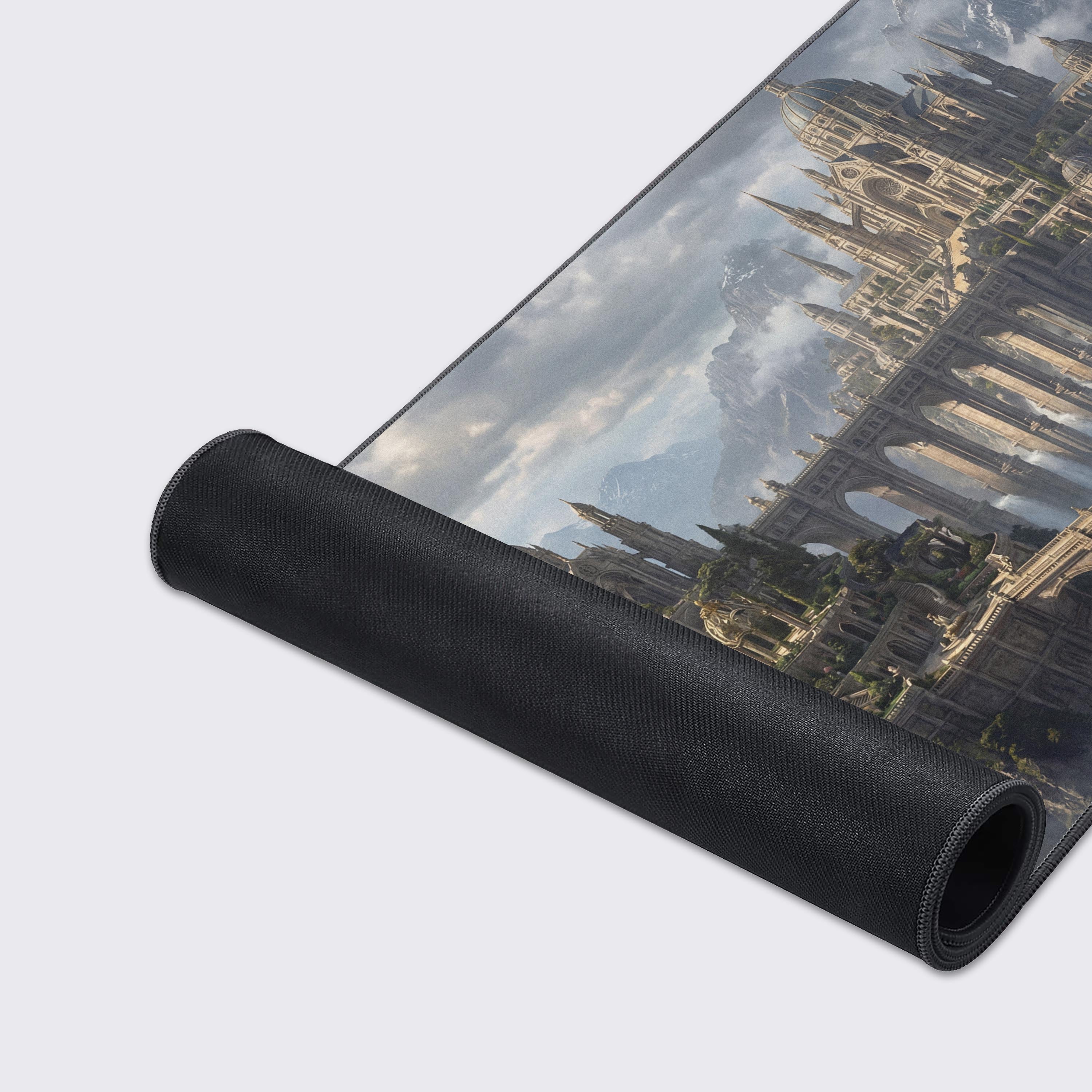 A close-up of the Aethelgard Ascent gaming desk mat, highlighting the high-quality fabric texture, stitched edges, and detailed artwork of the mountain castle. - Epic Design Pads & Mousepads