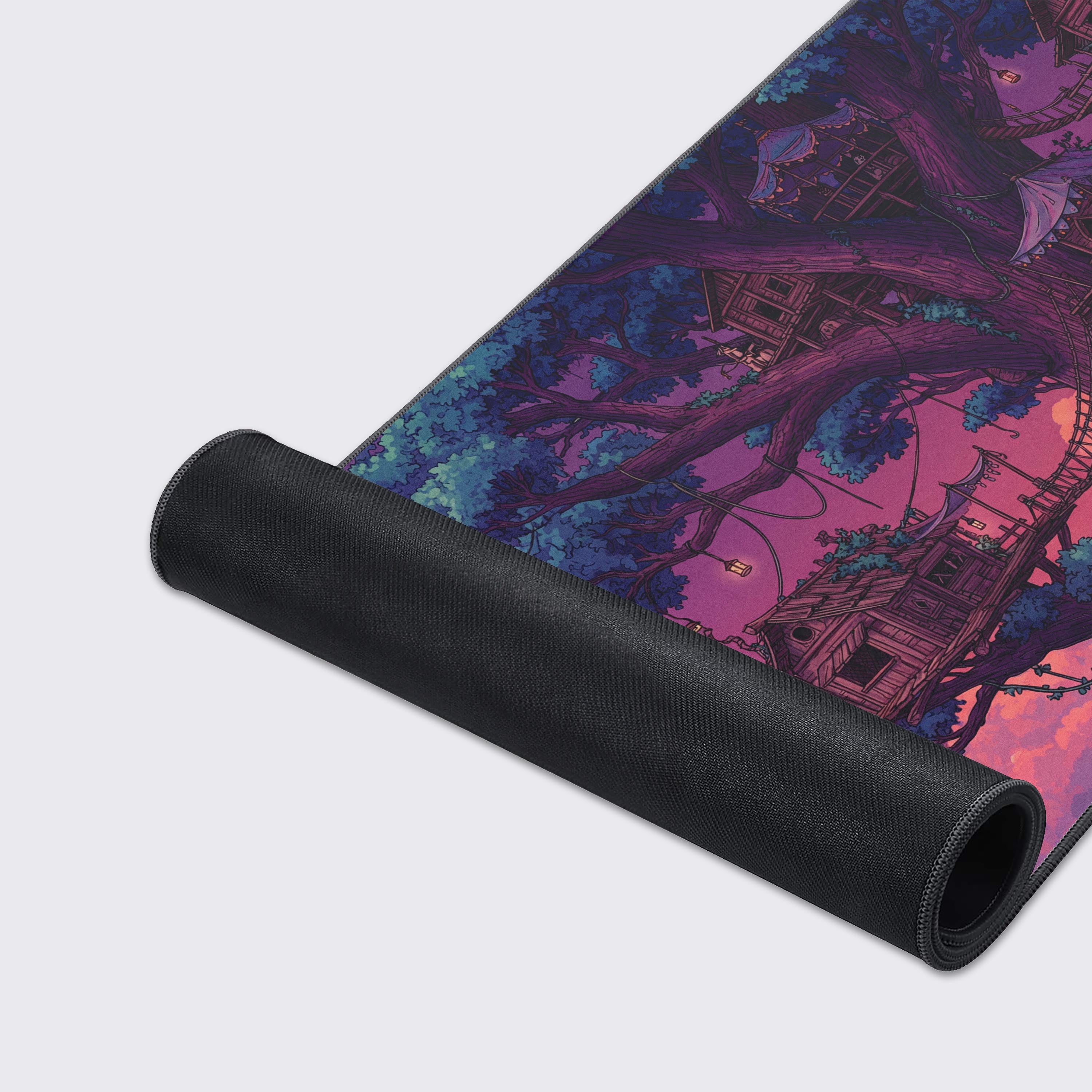 A close-up shot of the Sunset Heights gaming desk mat, detailing the smooth texture, quality stitched edges, and the intricate illustration of the magical treehouse city. - Epic Design Pads & Mousepads