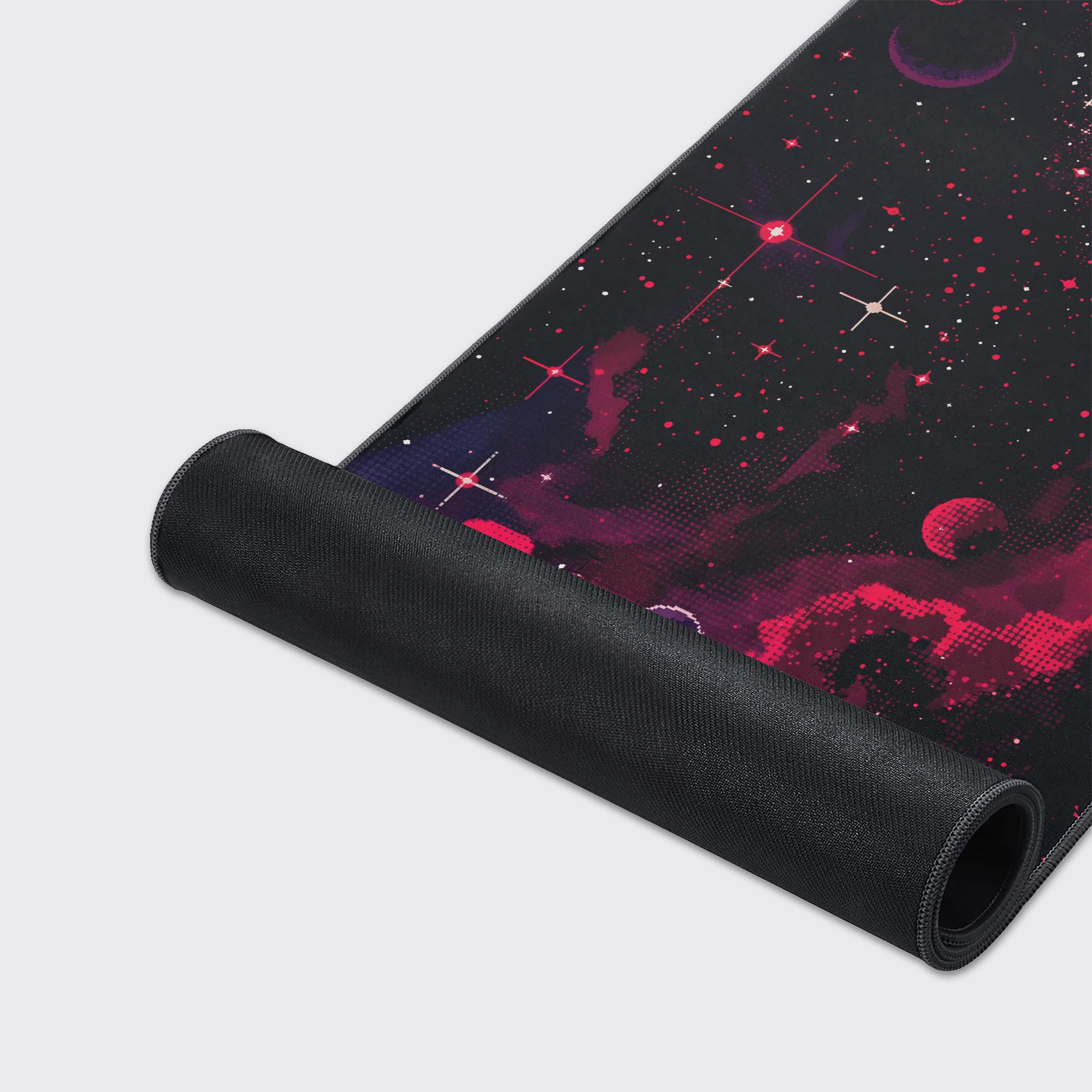 A close-up of the Pixel Inferno gaming desk mat showing the durable stitched edges and smooth fabric texture, highlighting the vibrant red and black pixel art space design. - Epic Design Pads & Mousepads