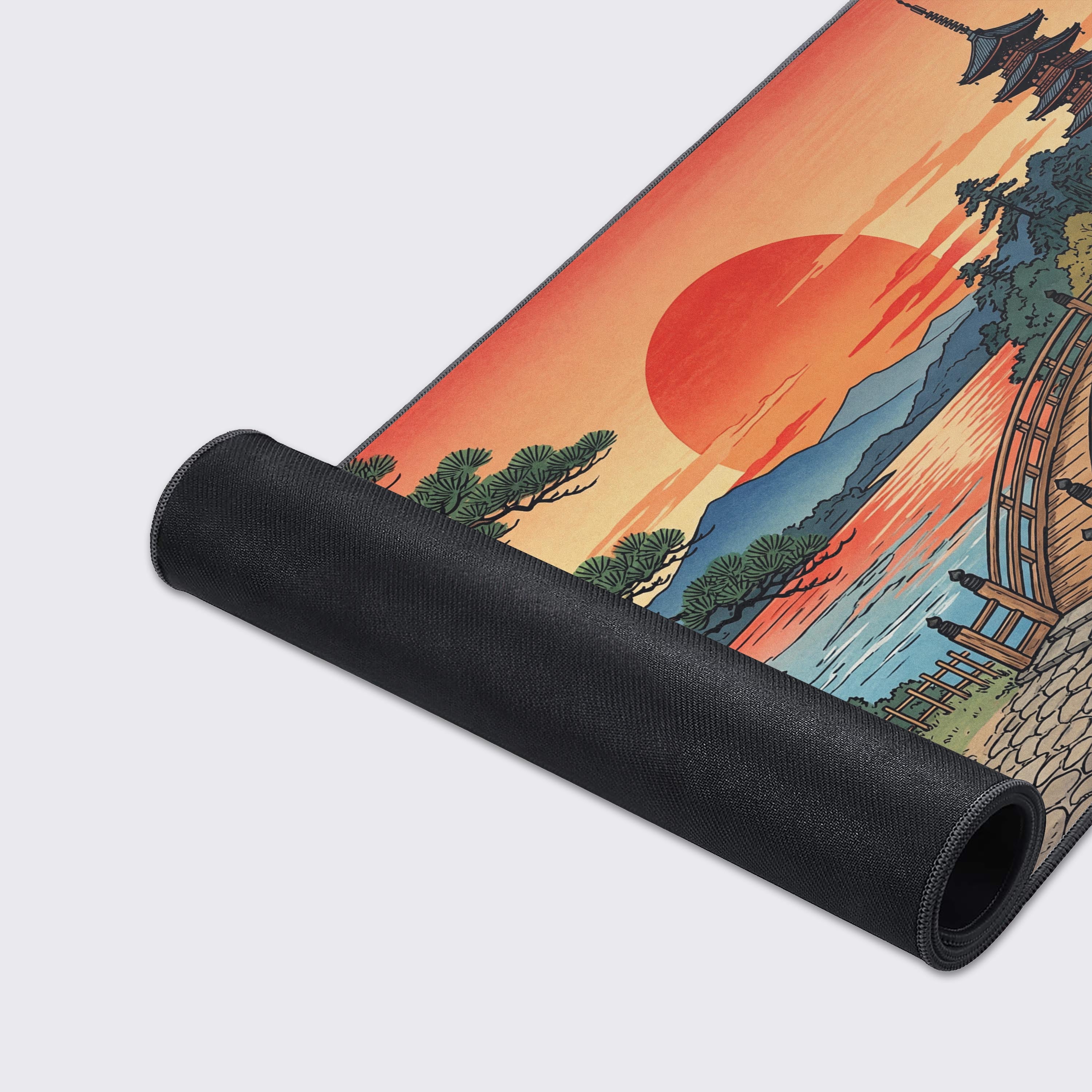 A close-up of the Sun Setting gaming desk mat, highlighting the fine texture of the fabric surface and durable stitched edges on the vibrant Ukiyo-e artwork. - Epic Design Pads & Mousepads